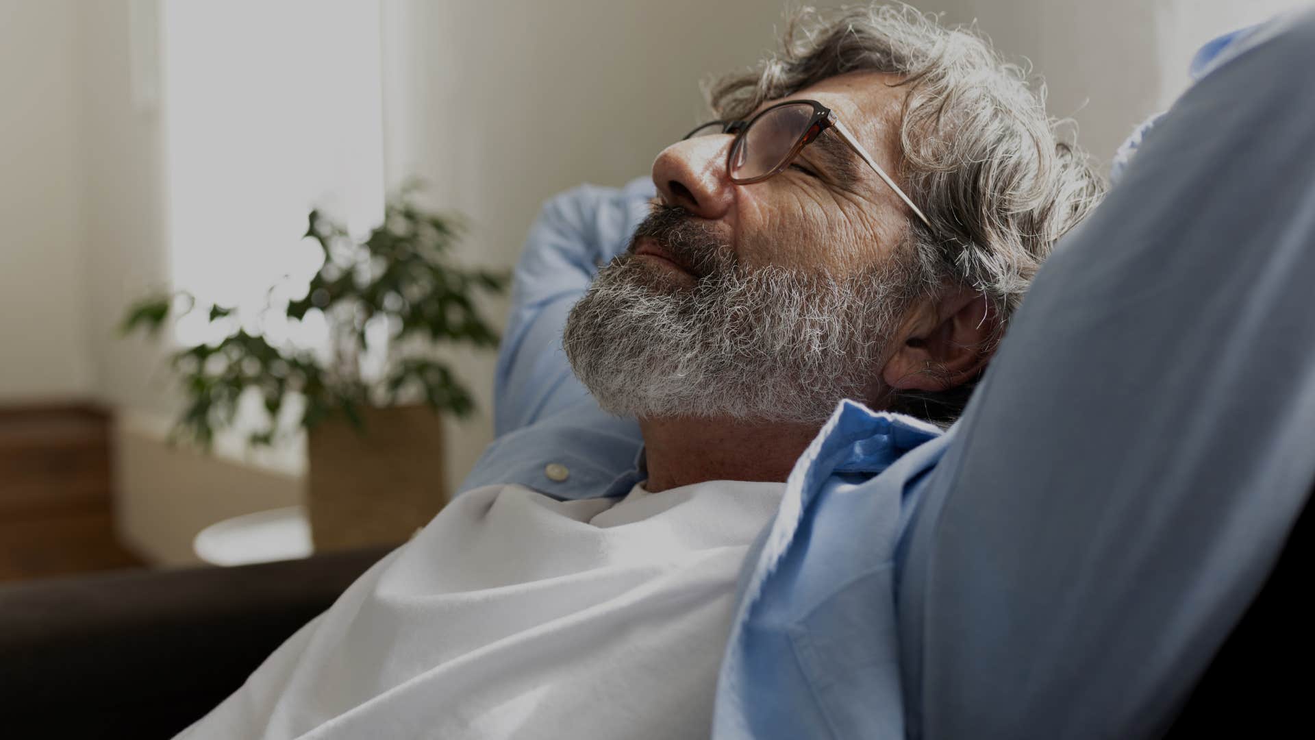 man staying up late to get time alone with no responsibility enjoying his own company relaxing