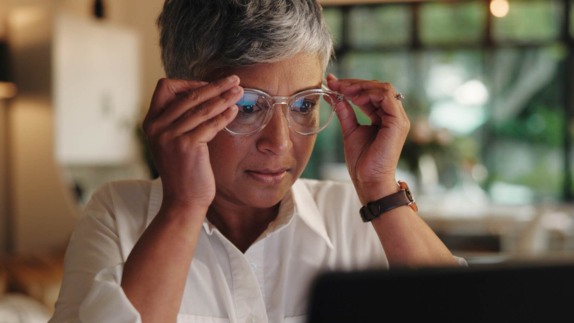 woman who holds herself to high standards working late
