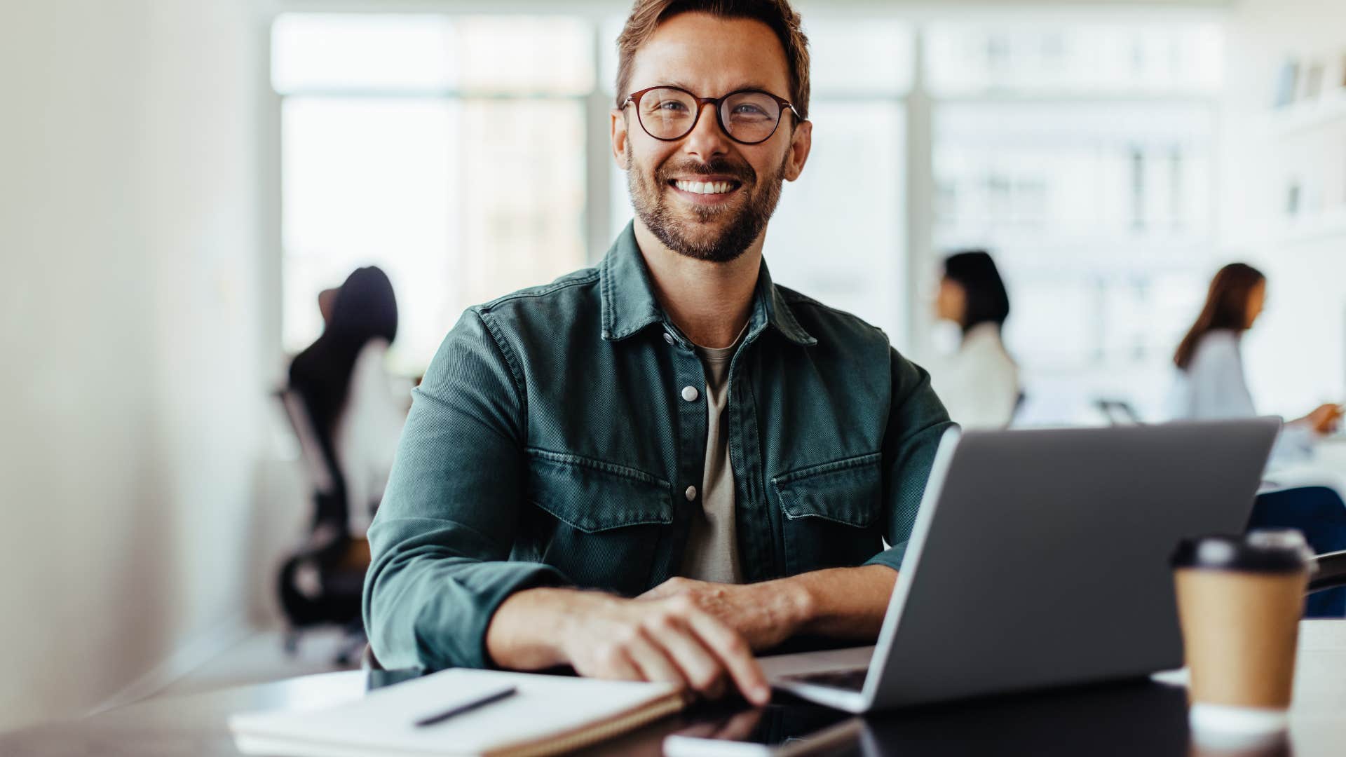 smiling man is comfortable being present