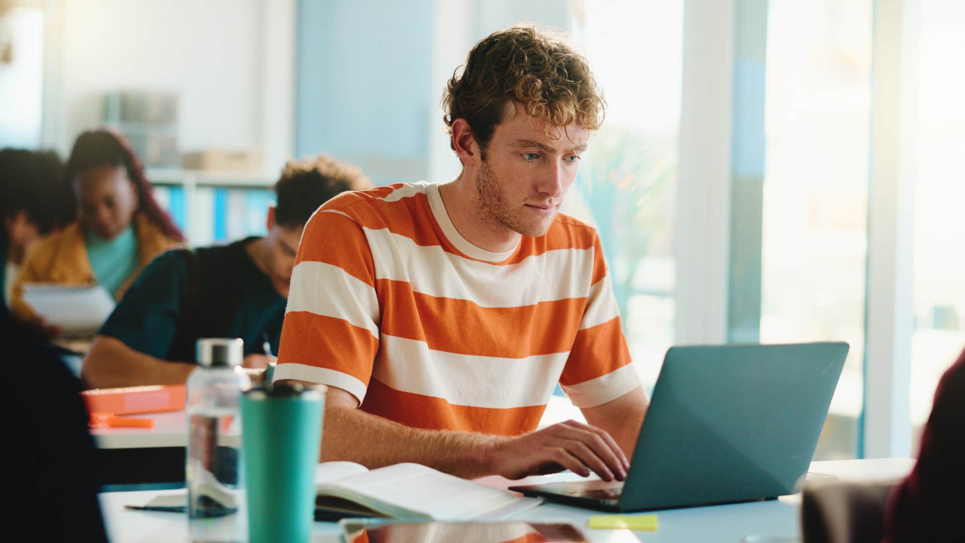 focused man working on laptop overcoming failure