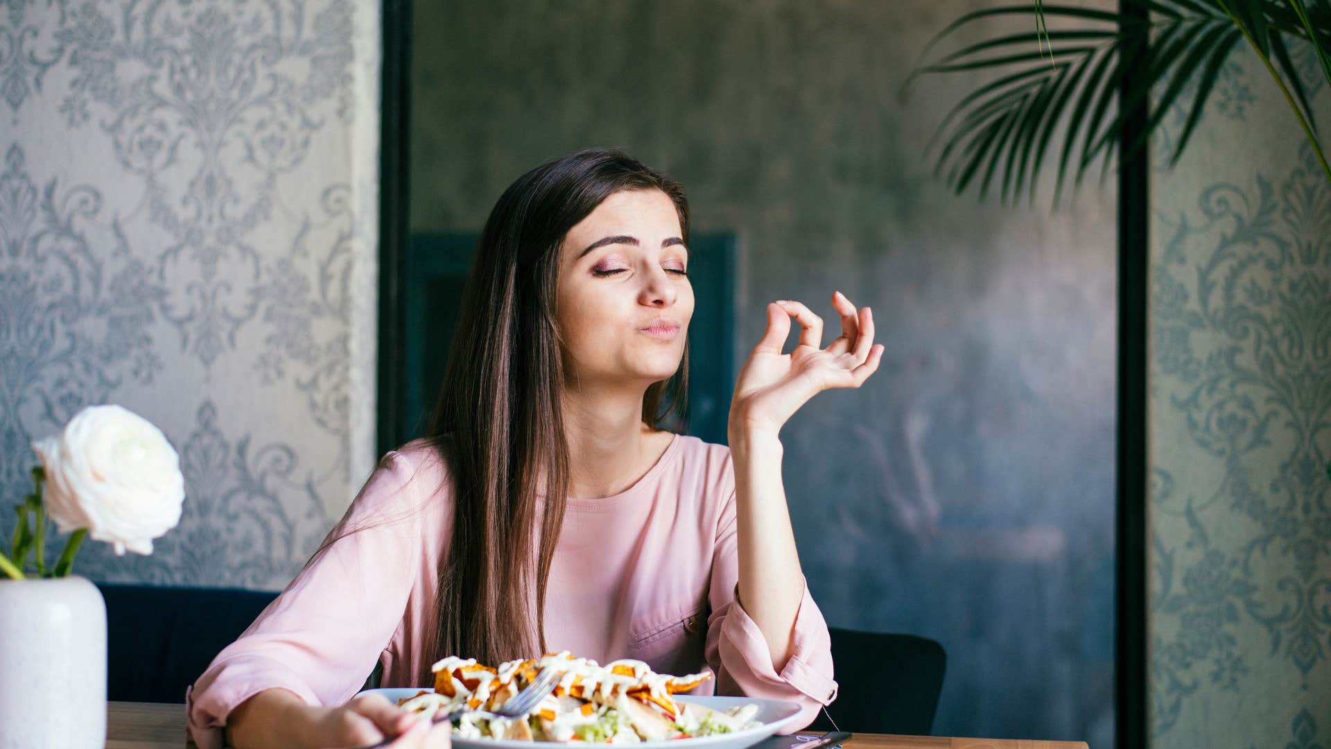 woman eating her go-to comfort food at home