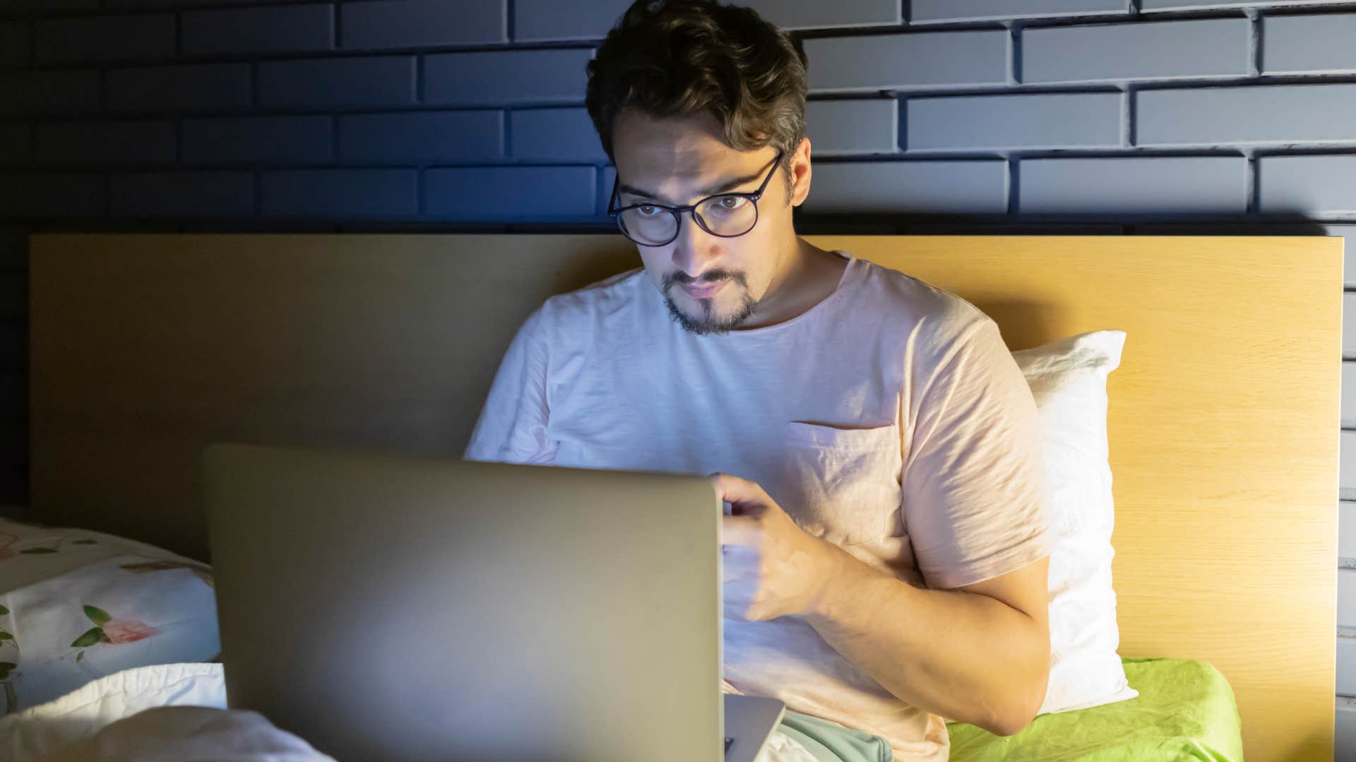 man who's constantly busy working on his laptop from bed