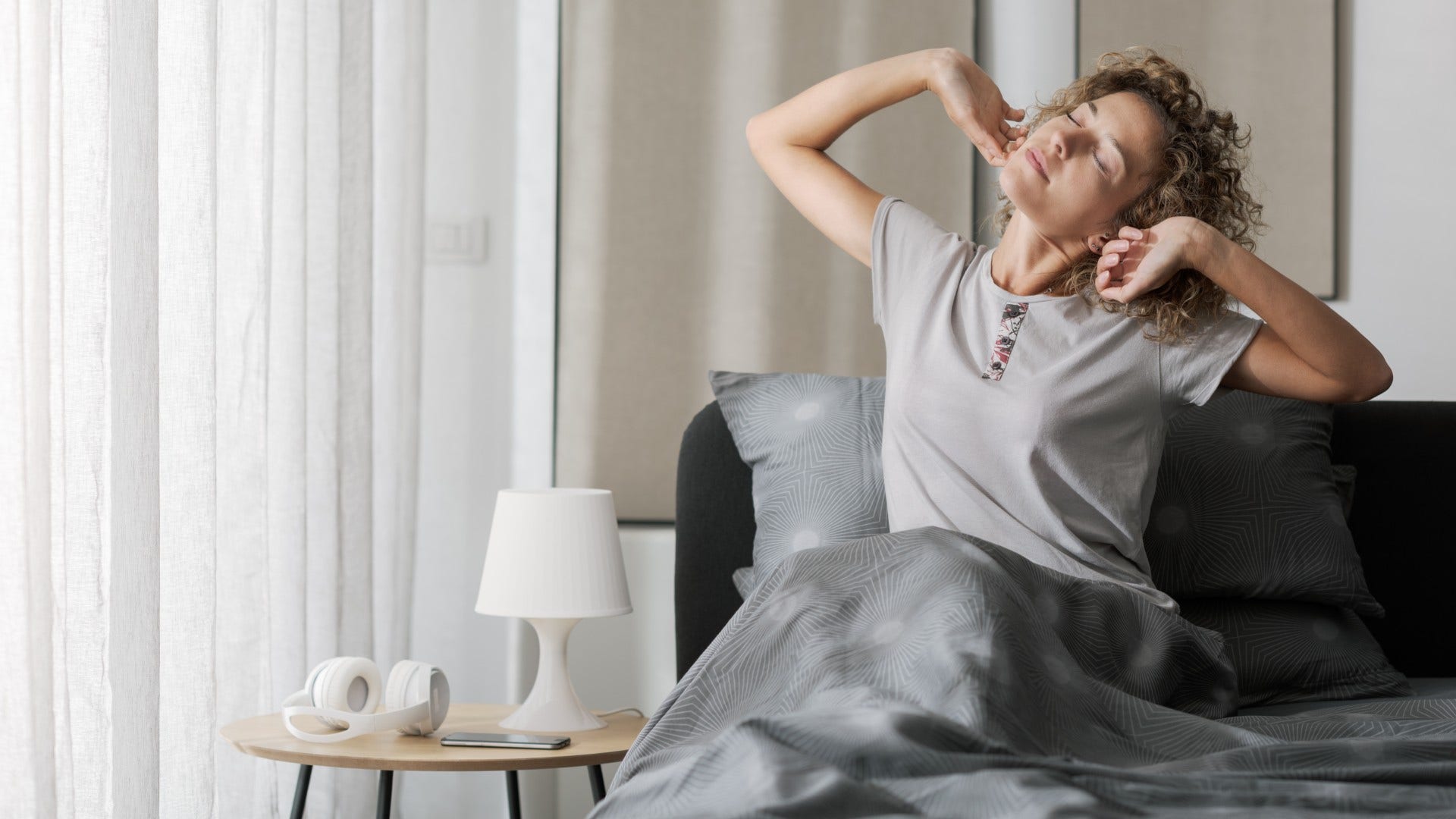 woman who wakes up before her alarm thinks ahead on responsibilities