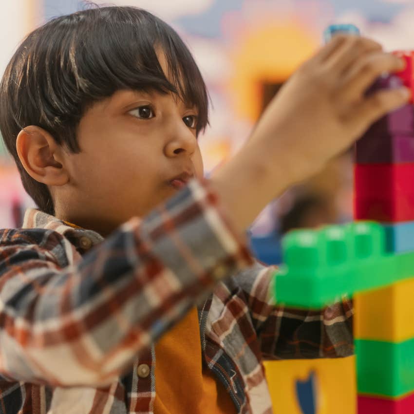 Little boy entertaining himself without a screen