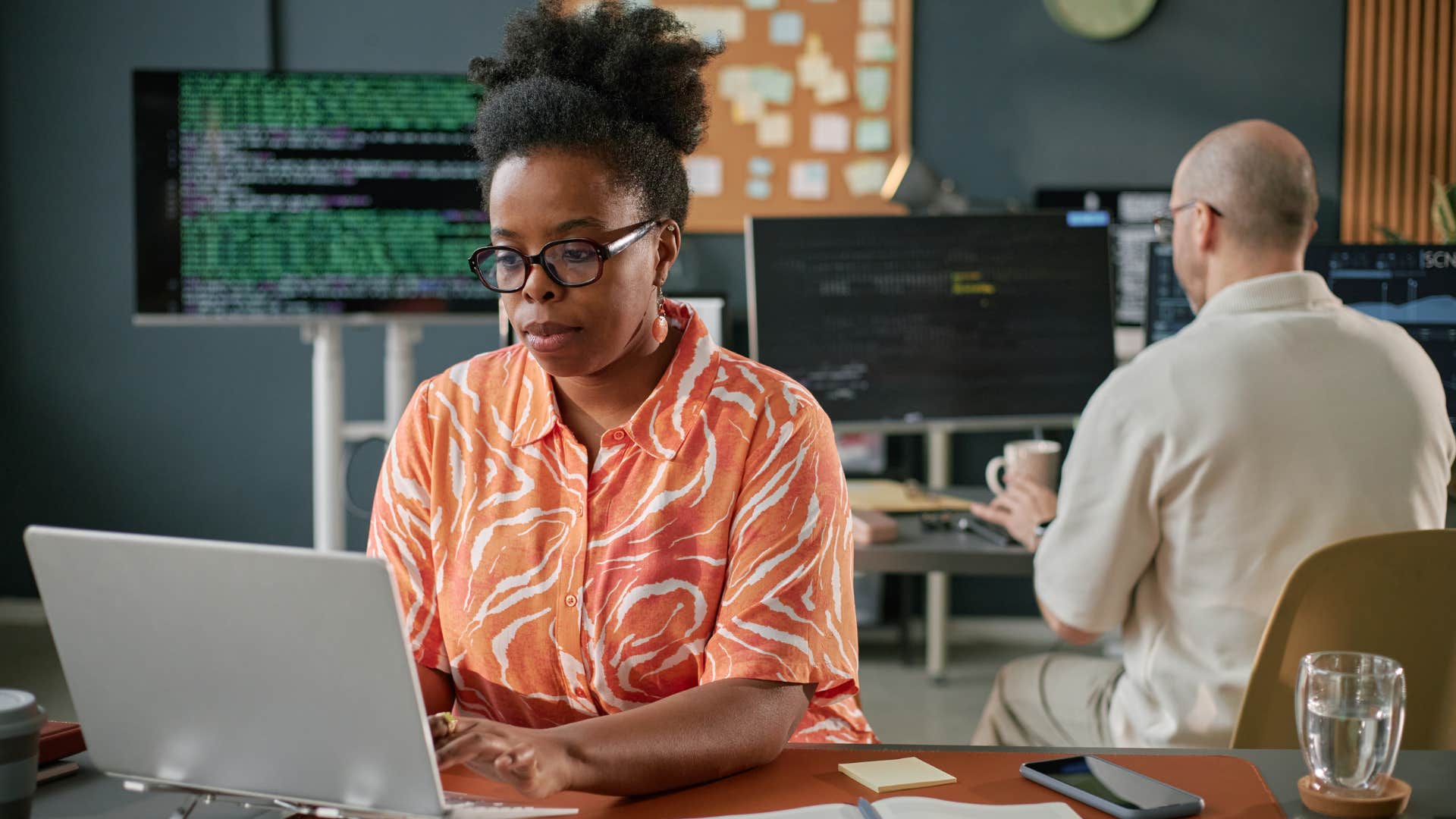 Focused people in office showing traits that thrive