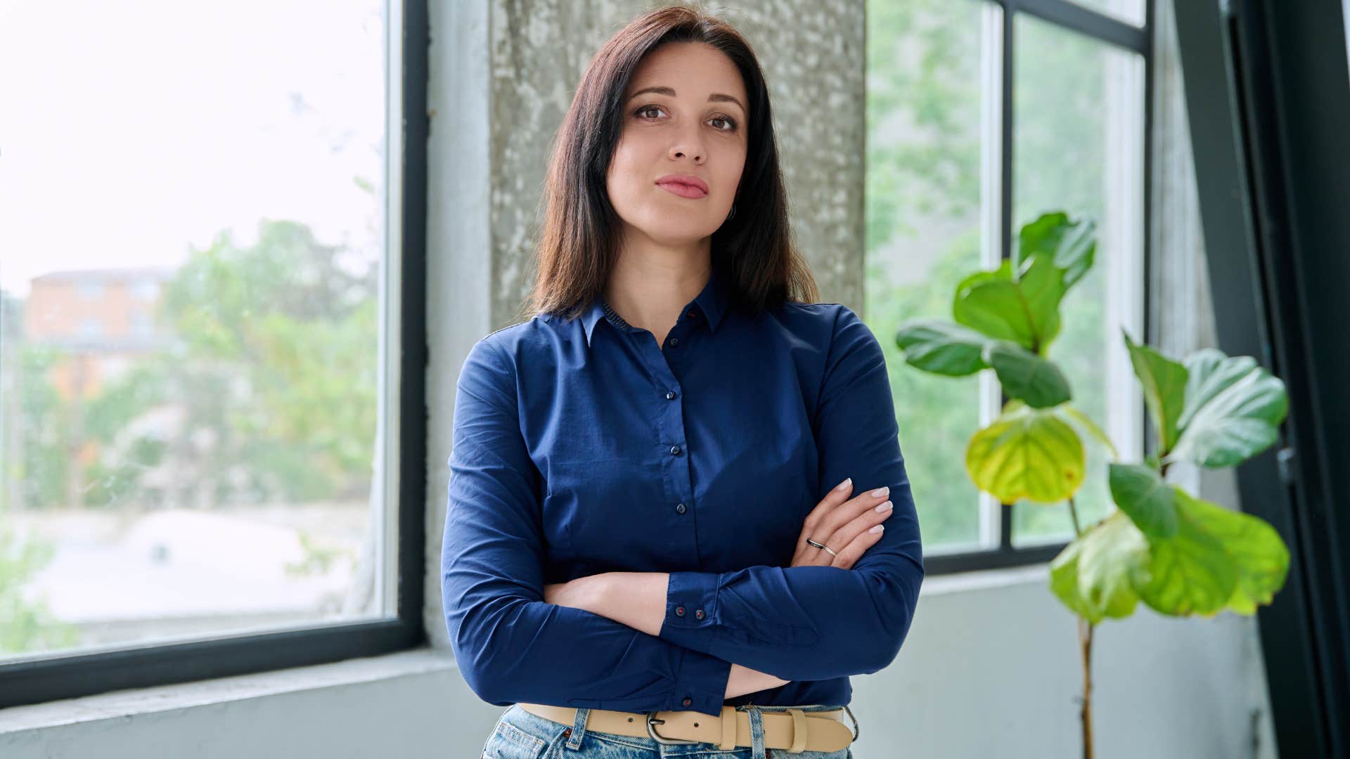 serious person with arms crossed