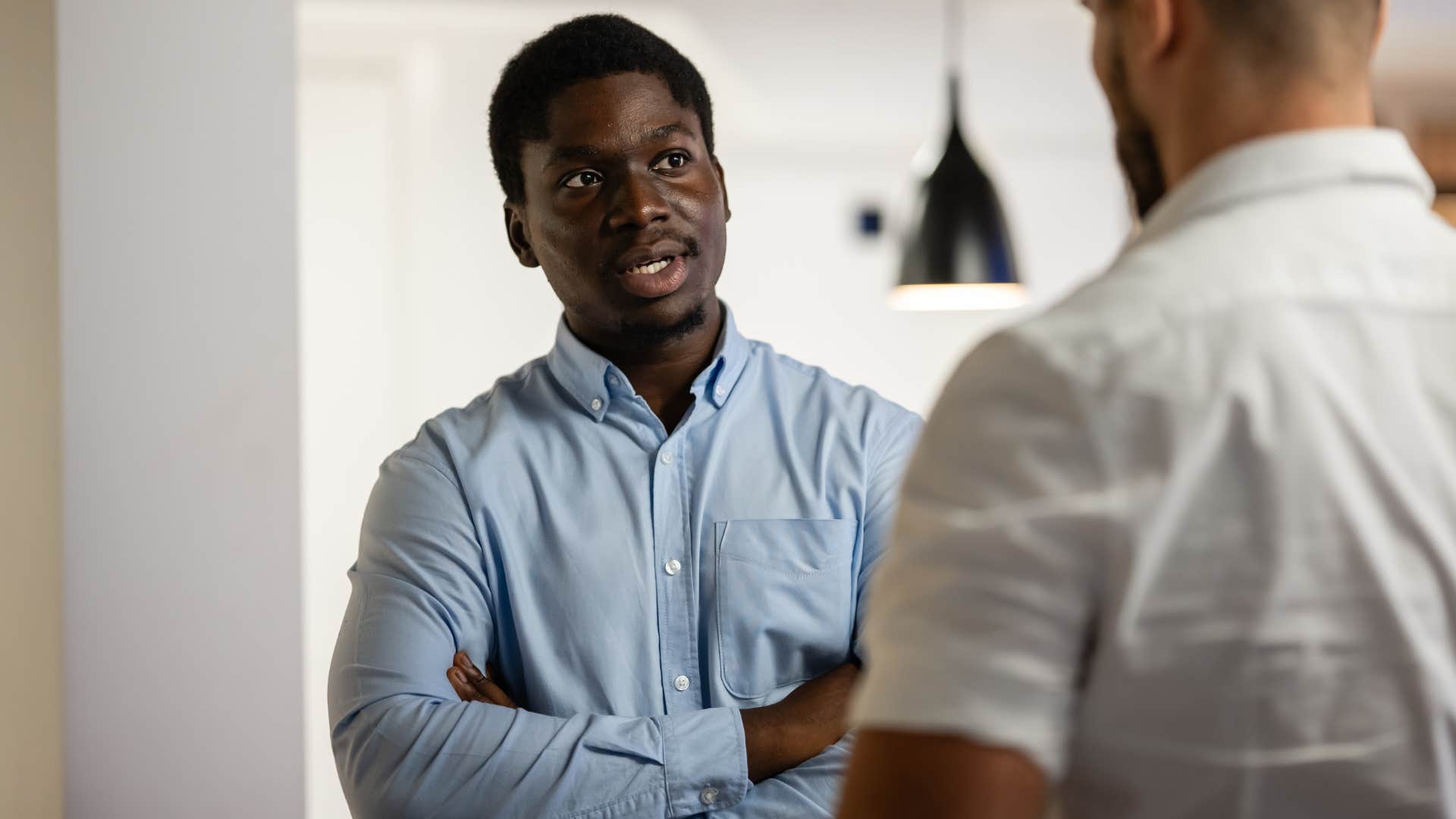 man confronting friend telling him to say what you mean