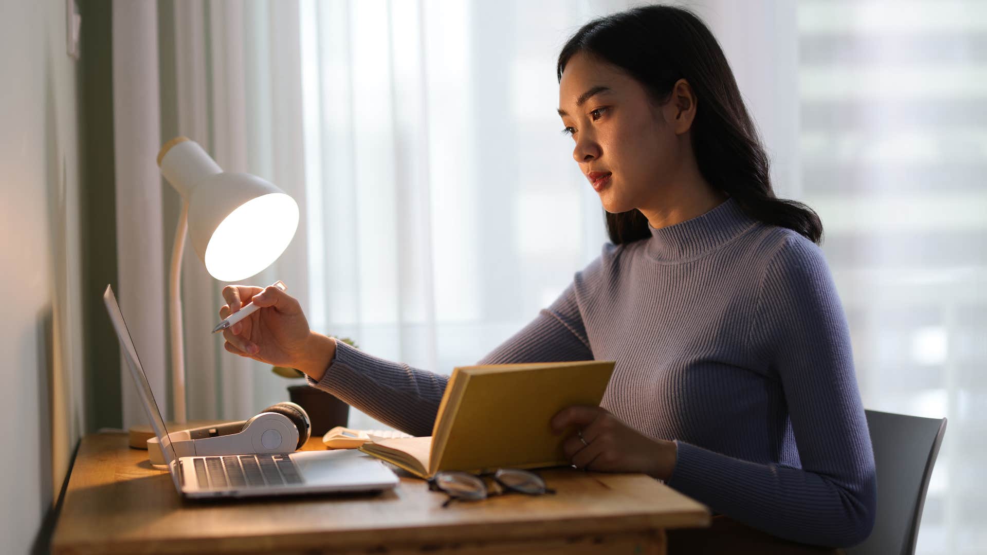 woman who still writes things down instead of typing untangling complex issues