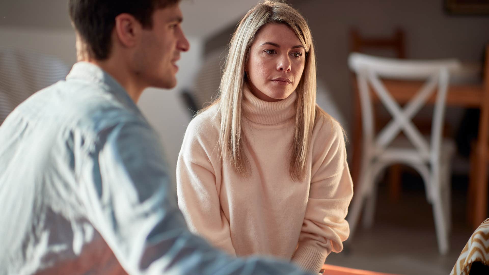 cold-hearted woman giving blank looks in conversation