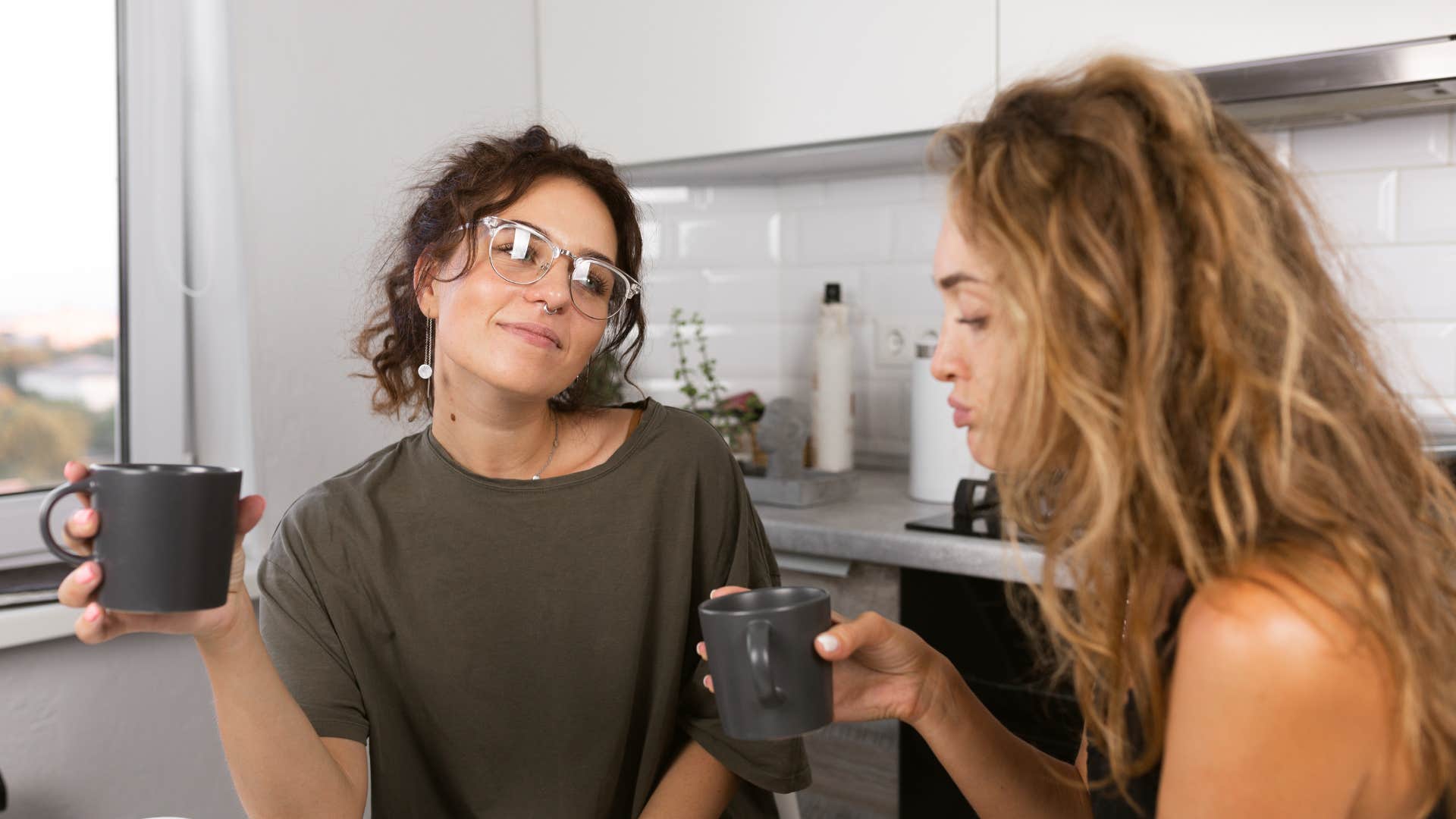 sarcastic woman talking with friend during serious moments