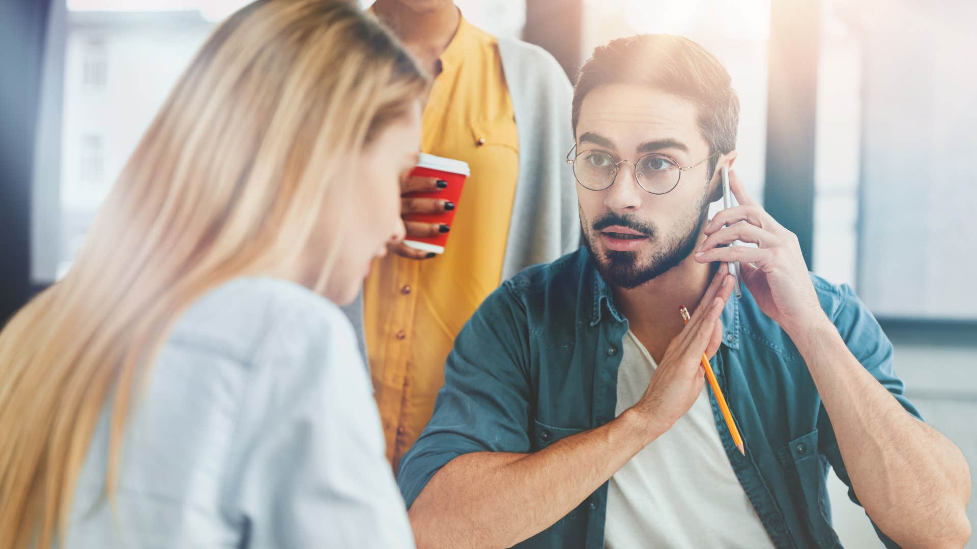 man stopping conversation due to woman interrupting
