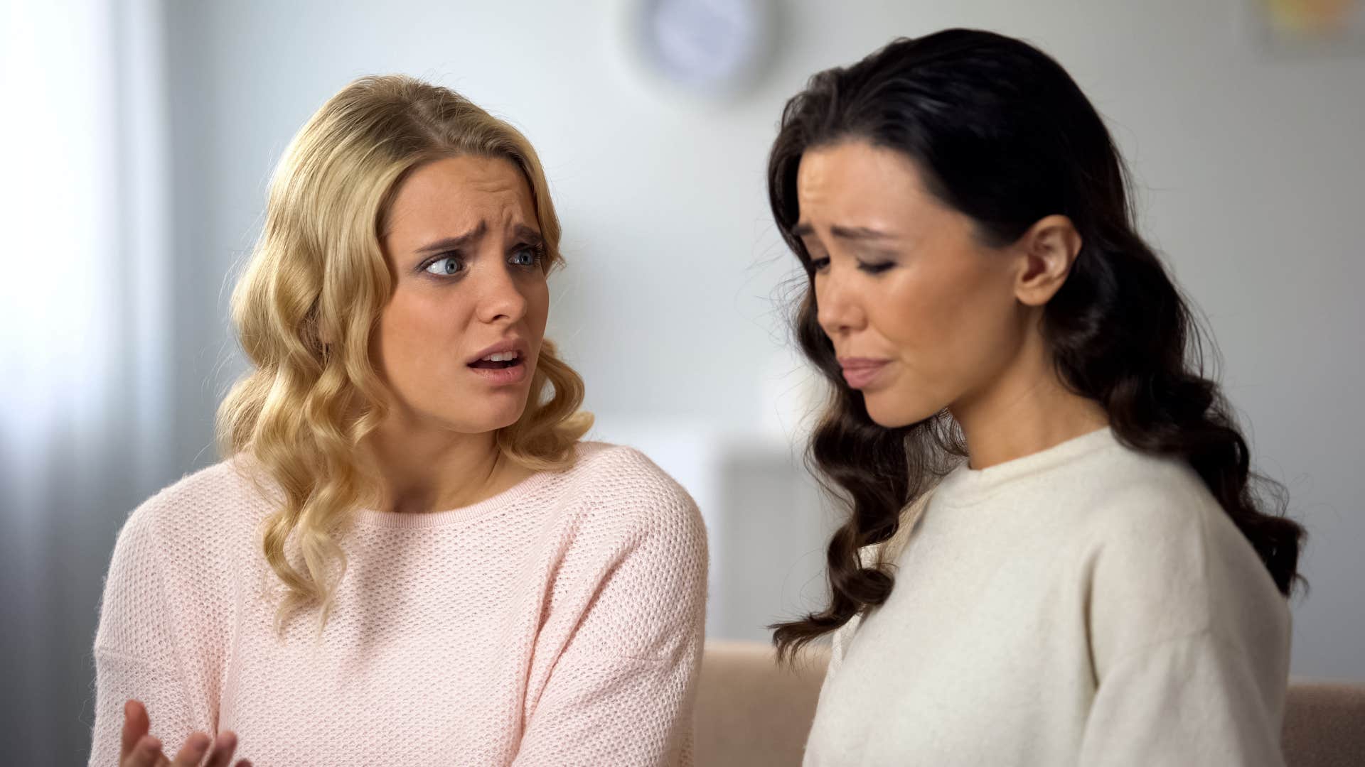 rude cold-hearted woman invalidating her upset friend's experiences