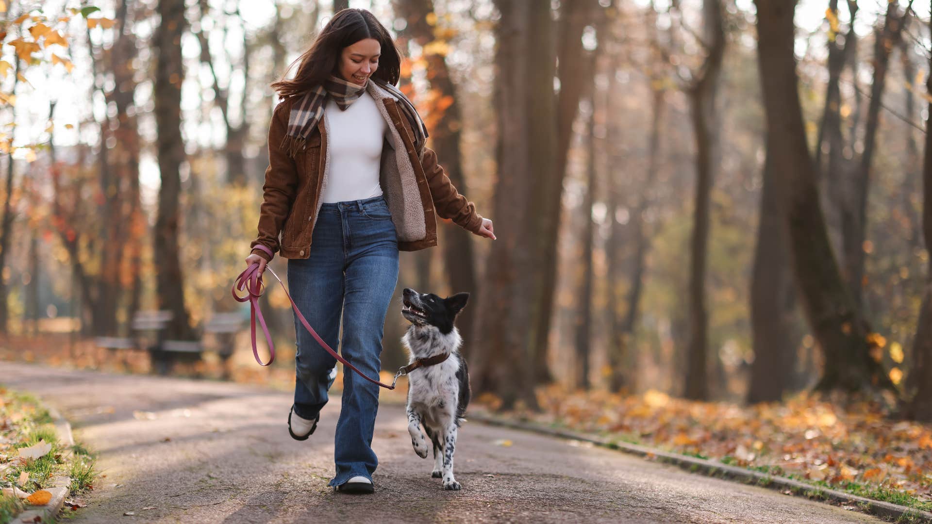 woman walking dog