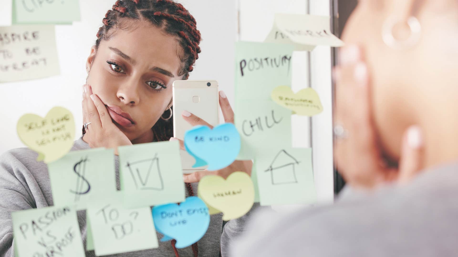 Uncertain person looks in mirror before getting married