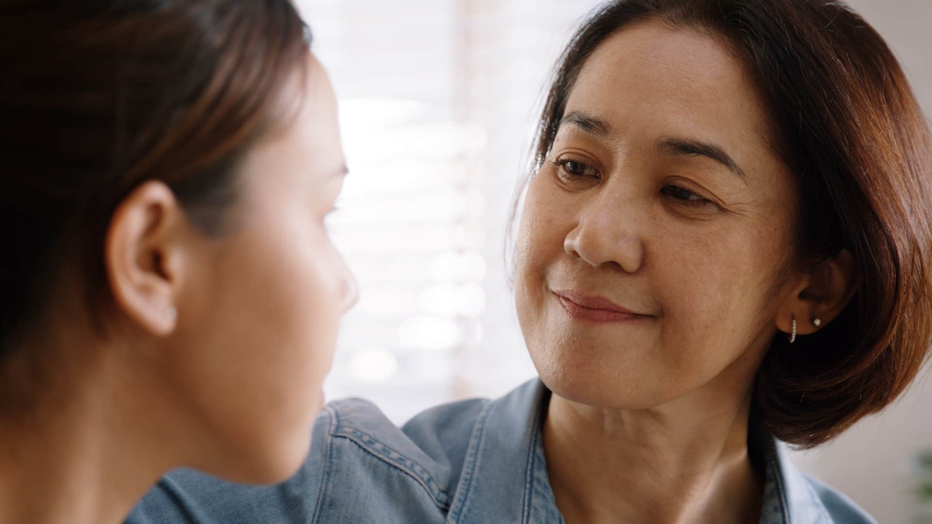 Loving mother supports daughter showing skill to trust gut