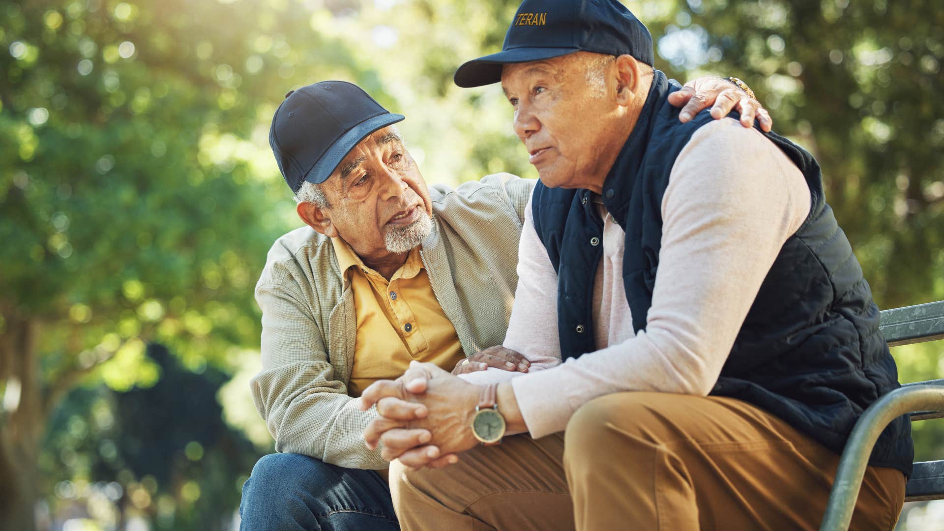 Man who talks about shared experiences with you sitting on a bench.