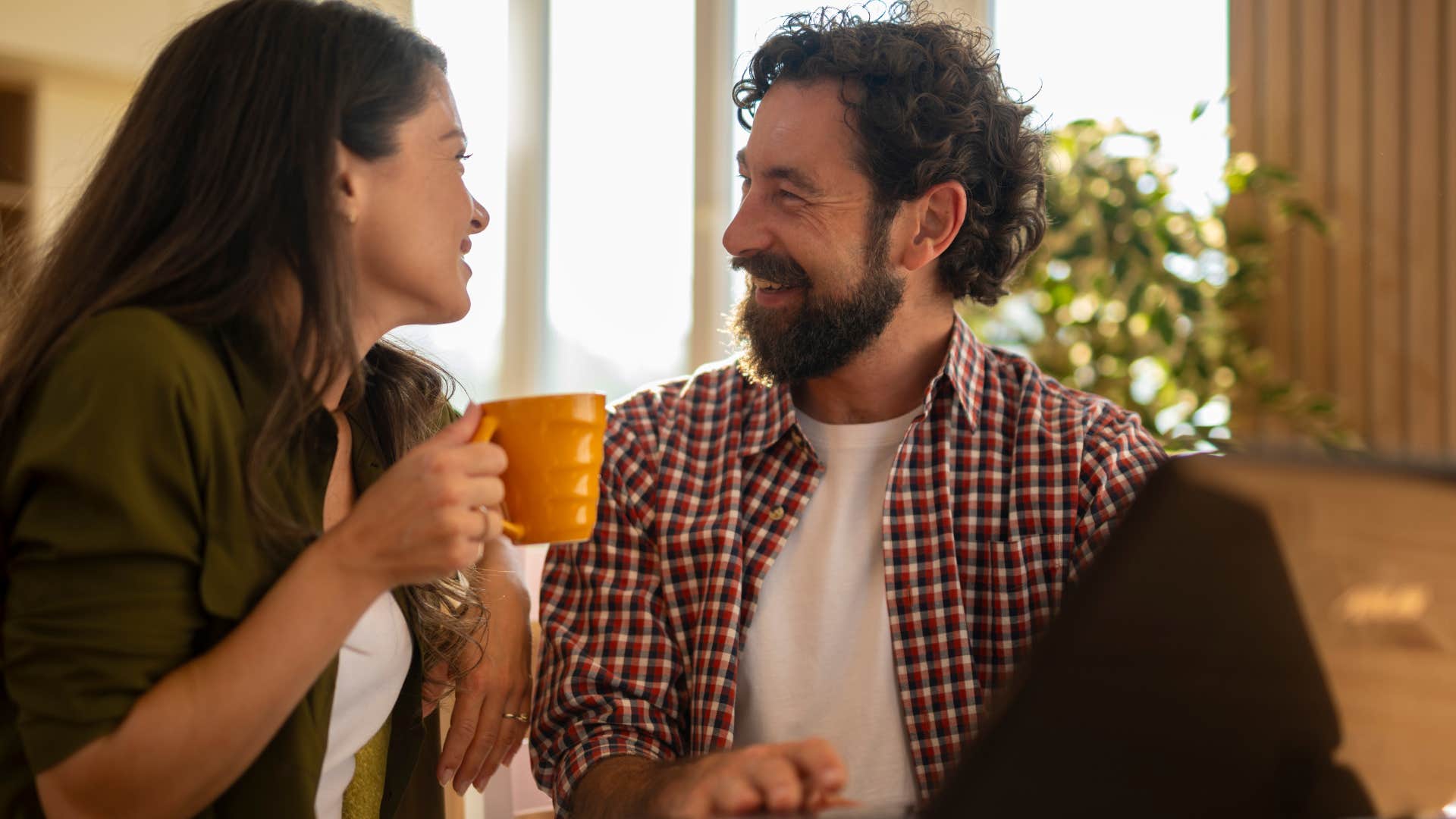 consistent and reliable man talking to his wife over coffee