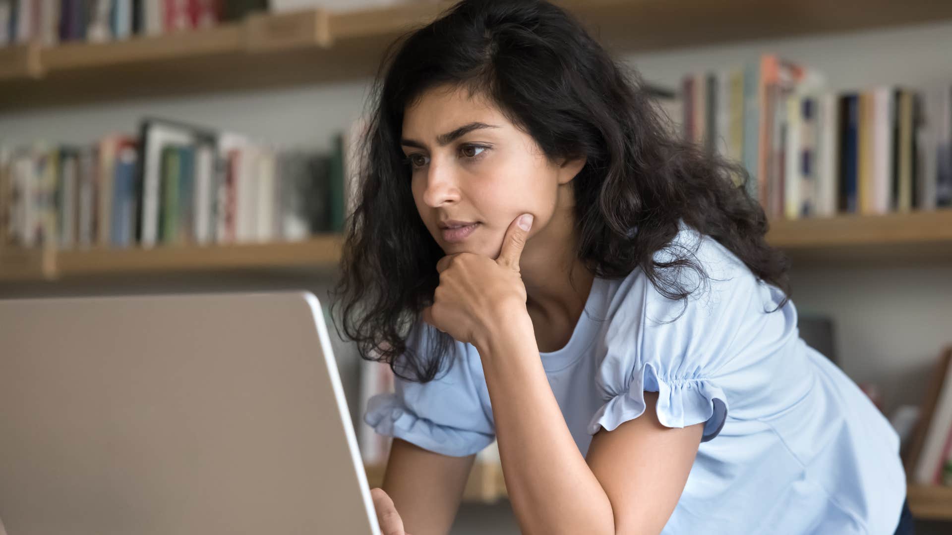 Gen Z woman on her computer accessing convenience through ChatGPT