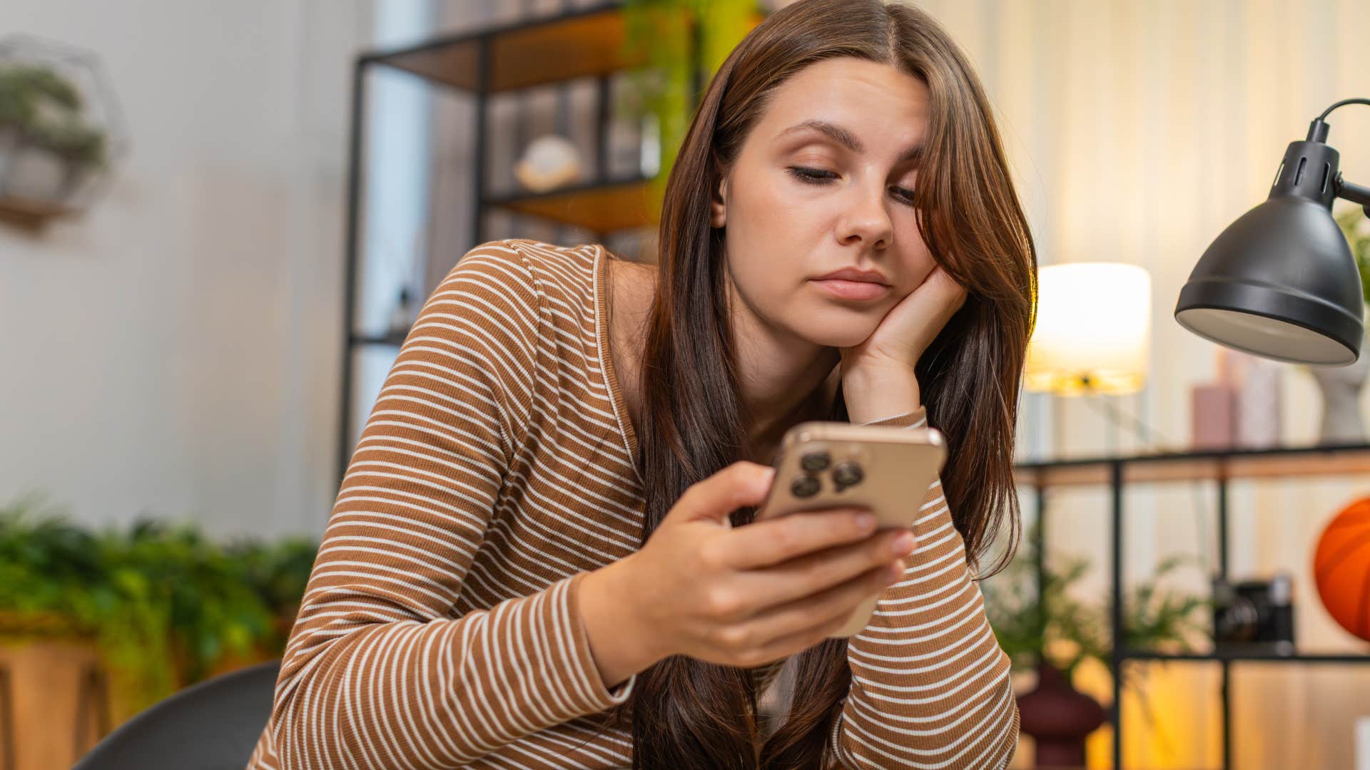 gen z woman on her phone bombarded with technological distractions