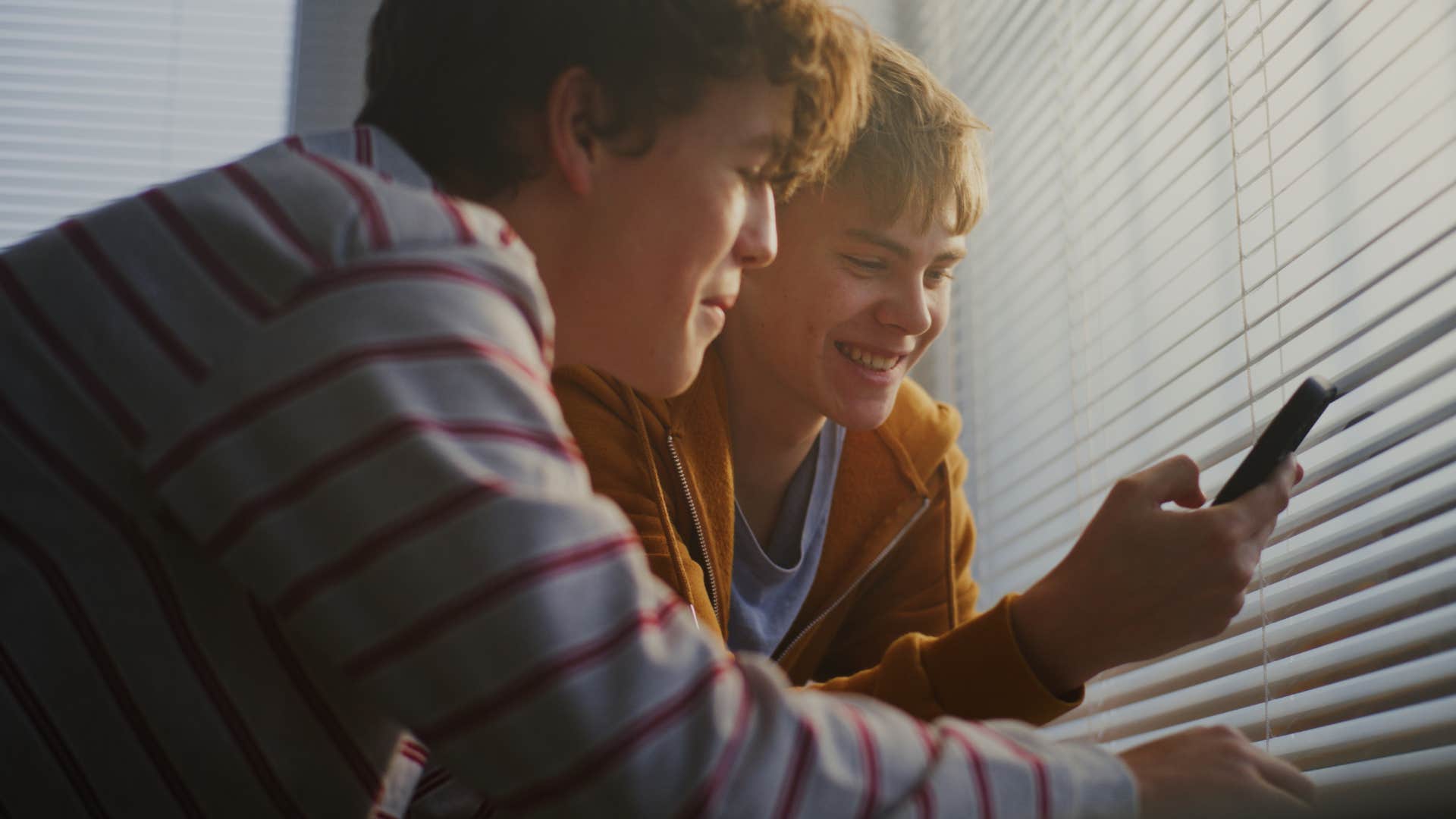 Gen Z teens learning from educational snapshots on their phones