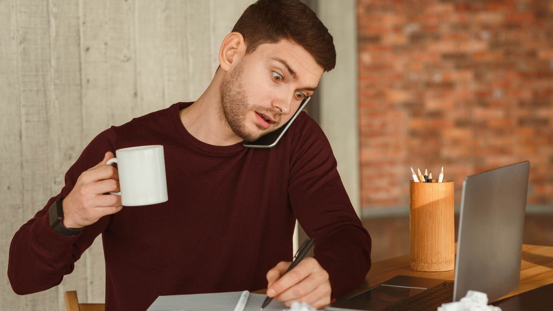 gen z man multitasking at work
