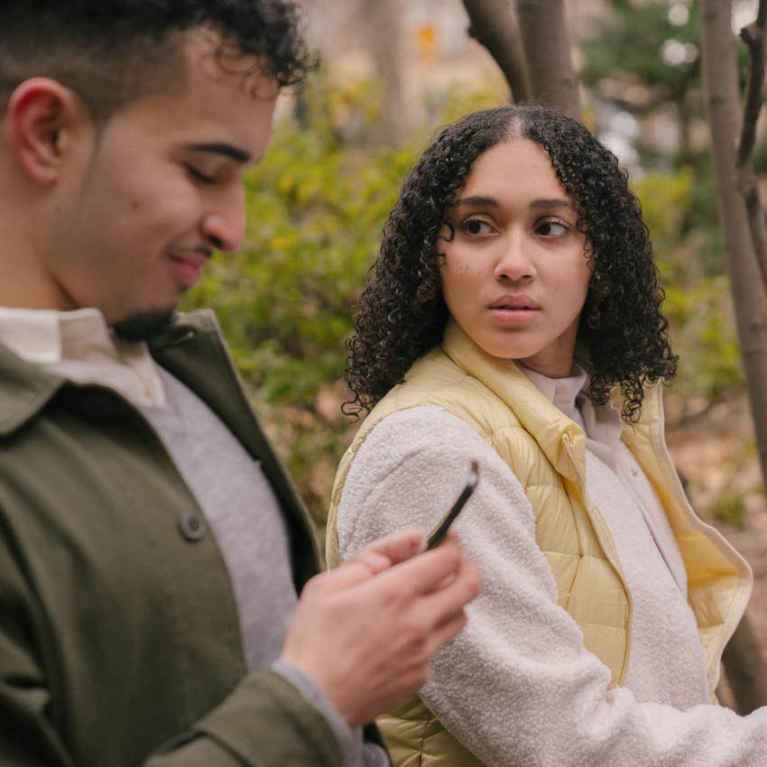 woman getting upset partner talking someone else