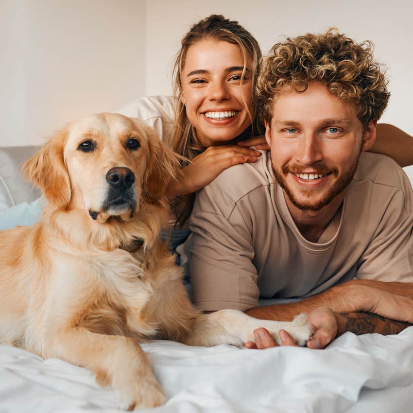 dog who is well behaved because he sleeps in bed with owners