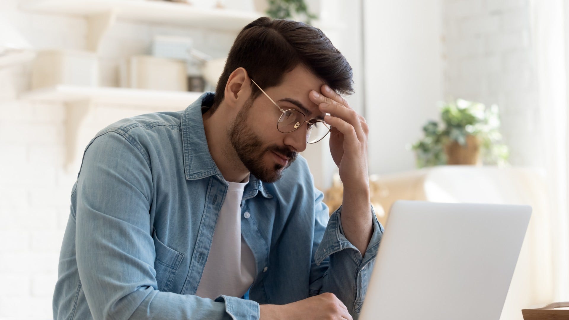 man who is emotionally exhausted overthinking small decisions