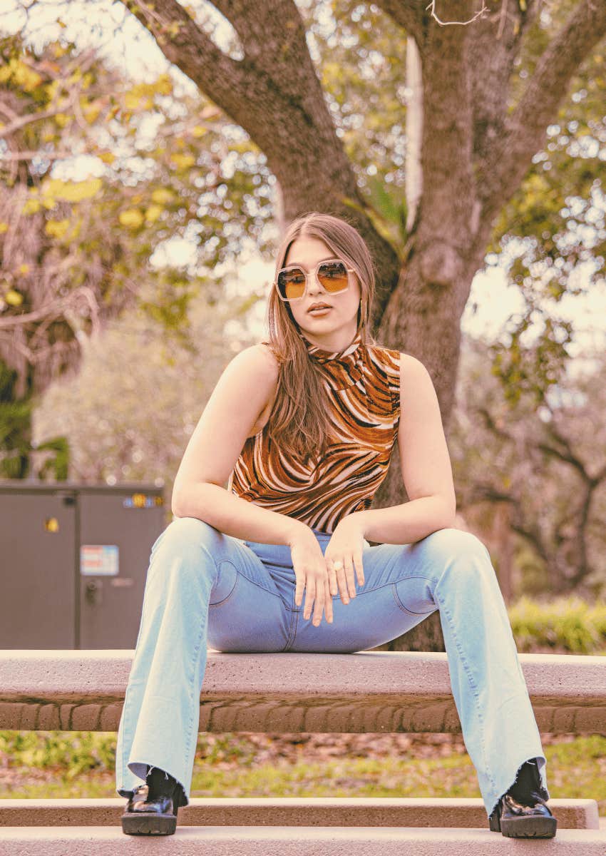 serious 70s woman sitting alone