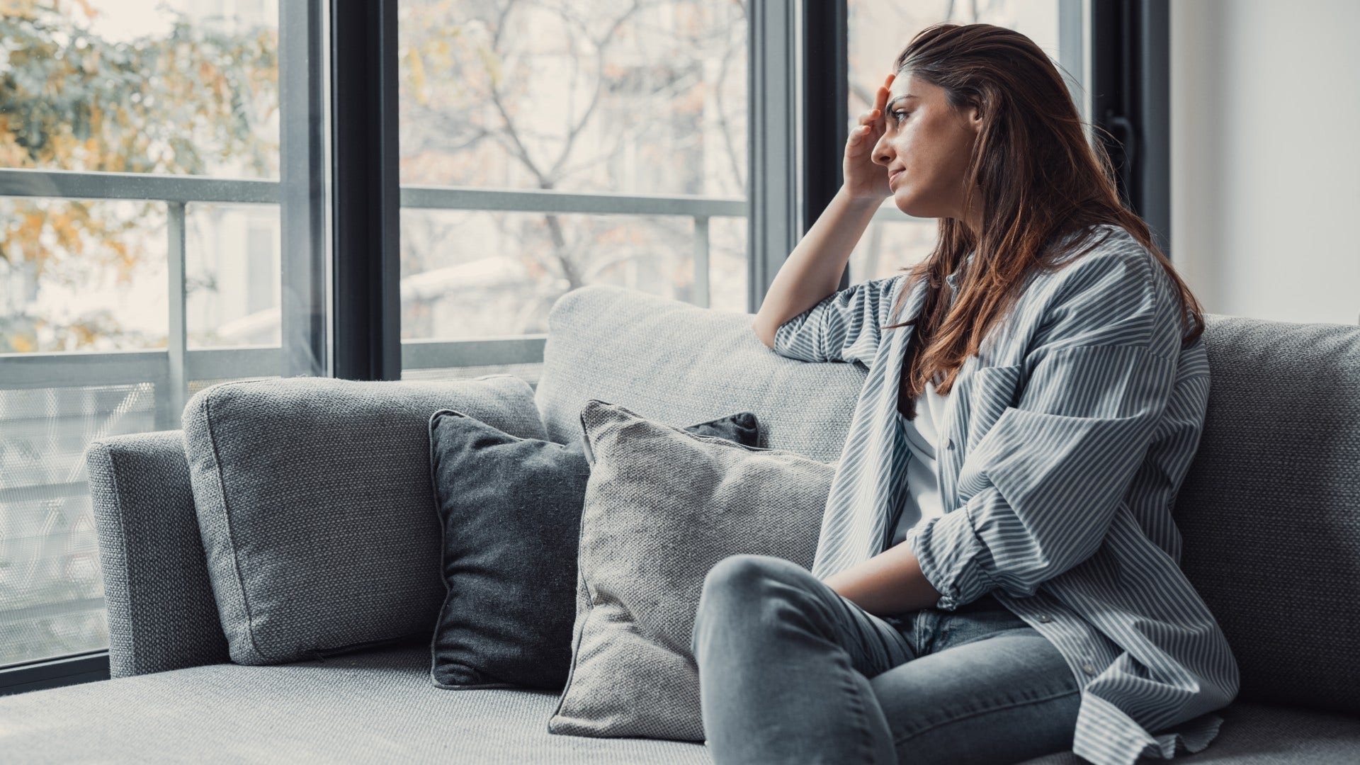 woman who is living the version of herself everyone expects as she feels a subtle grief for something unamed