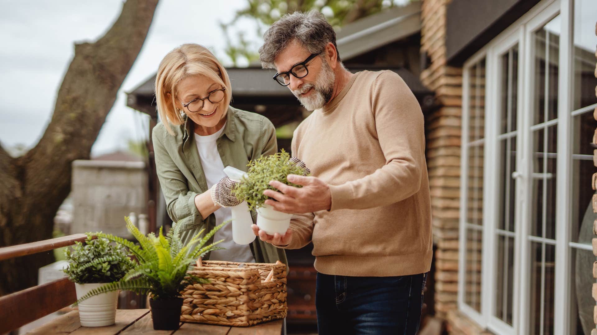 single man watering plants with woman on date
