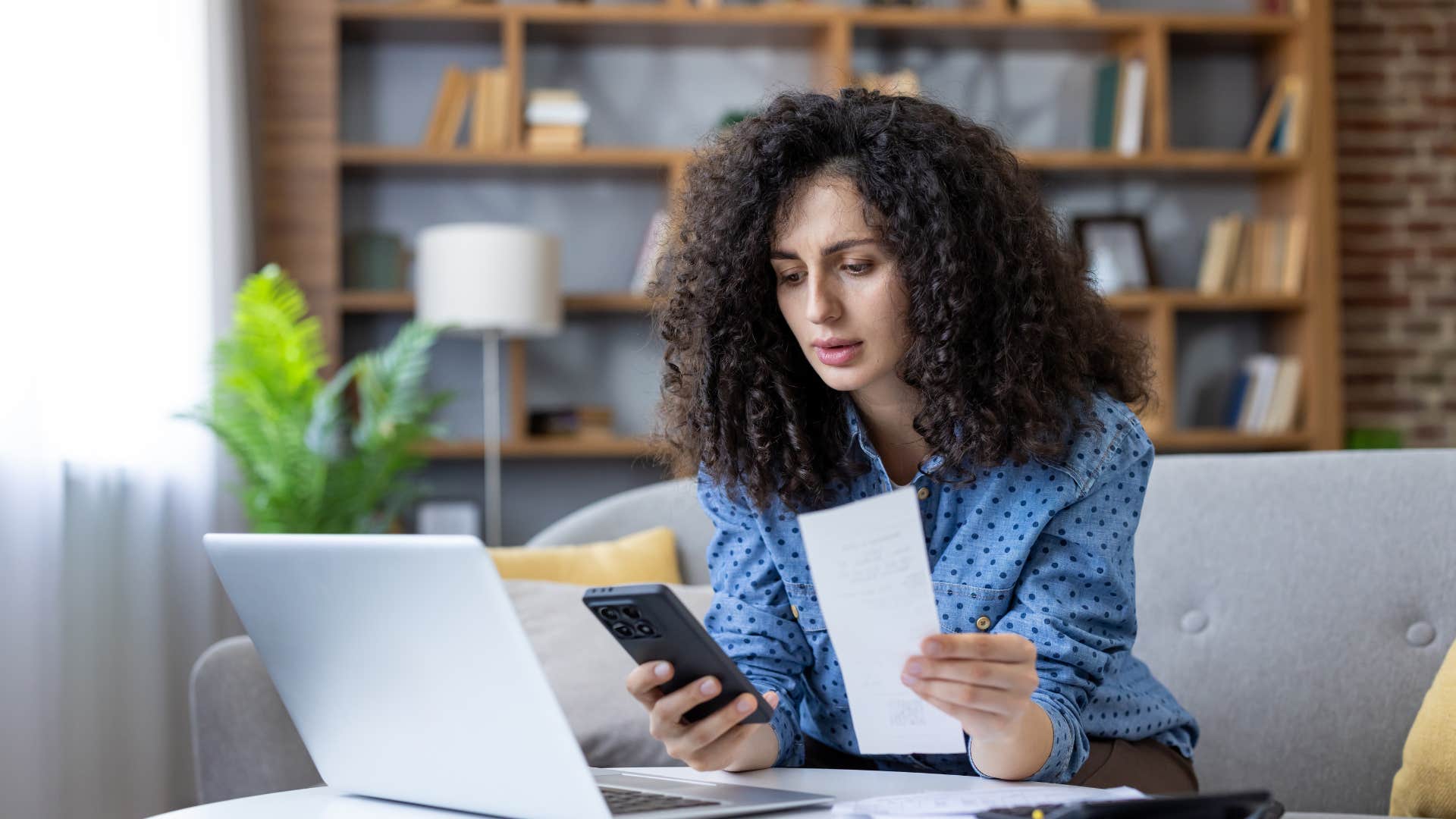 single woman who is financially responsible and secure paying bills