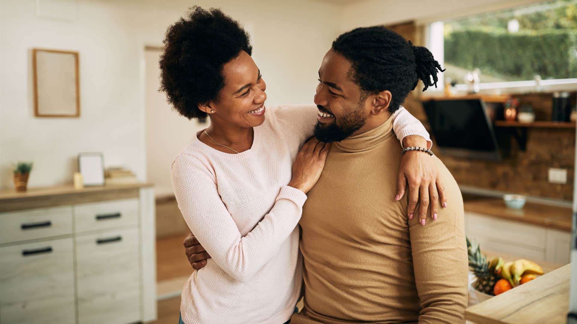 woman with a choice to become a parent hugging man