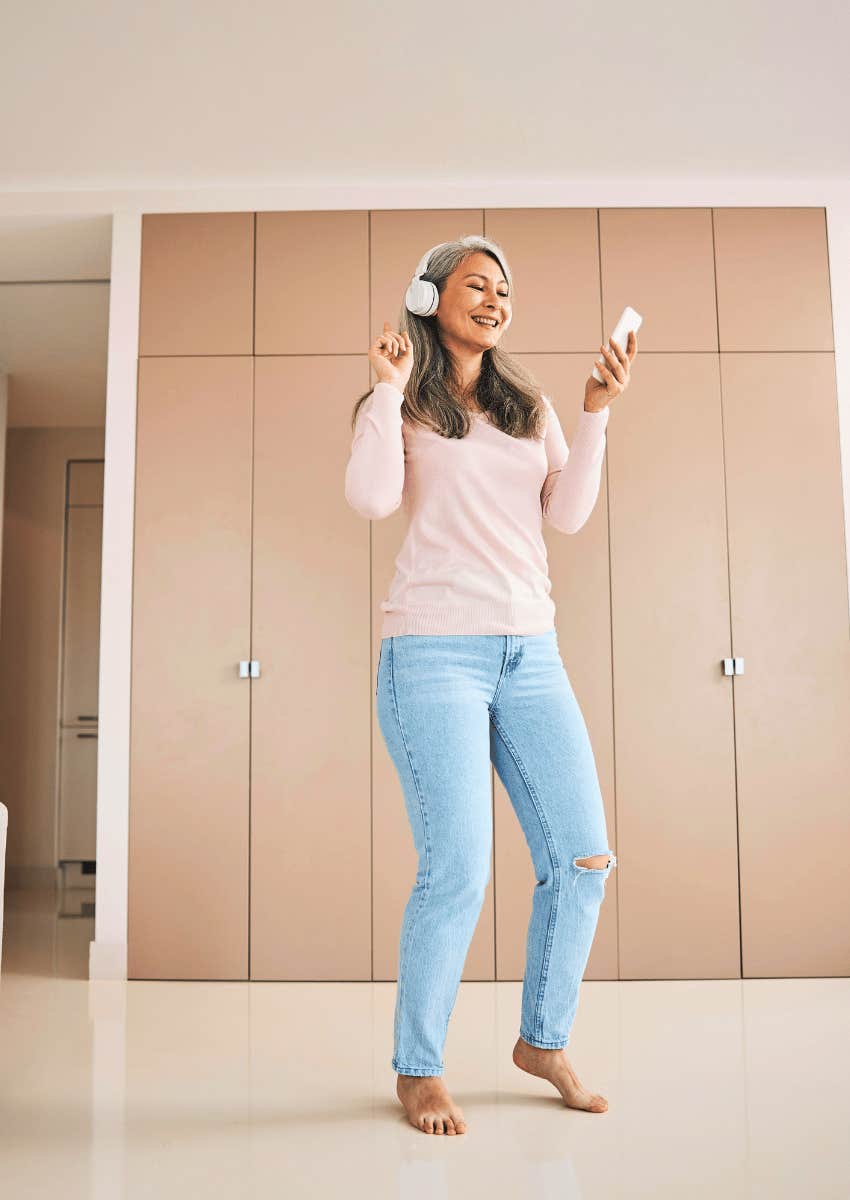 smiling older woman dancing