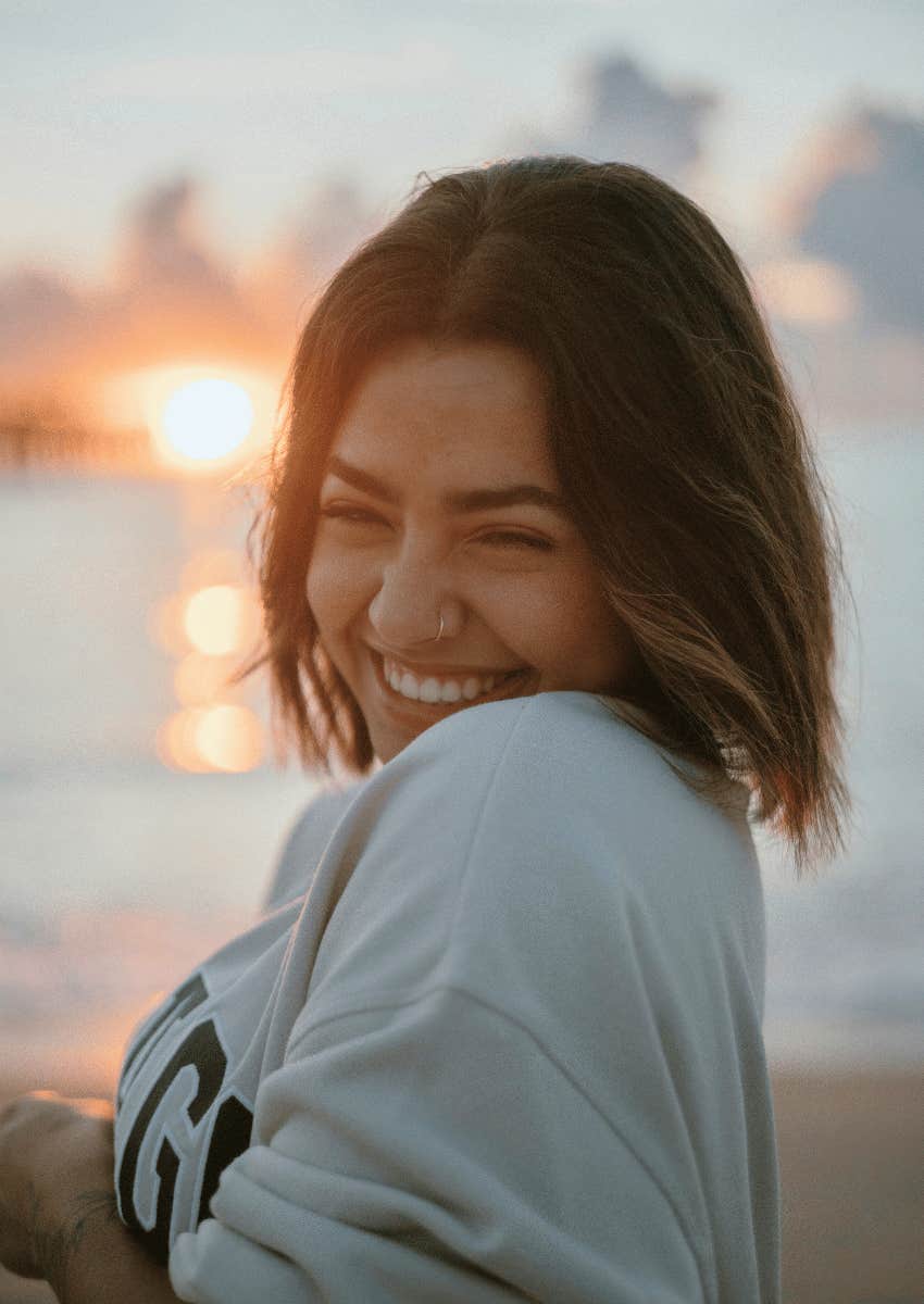 smiling woman not holding on to people who are ready to leave