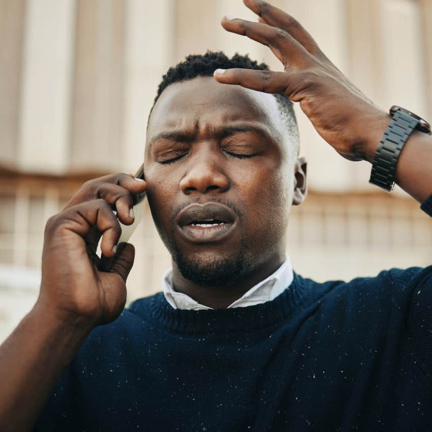 man feeling impatient with ignorance while talking on the phone