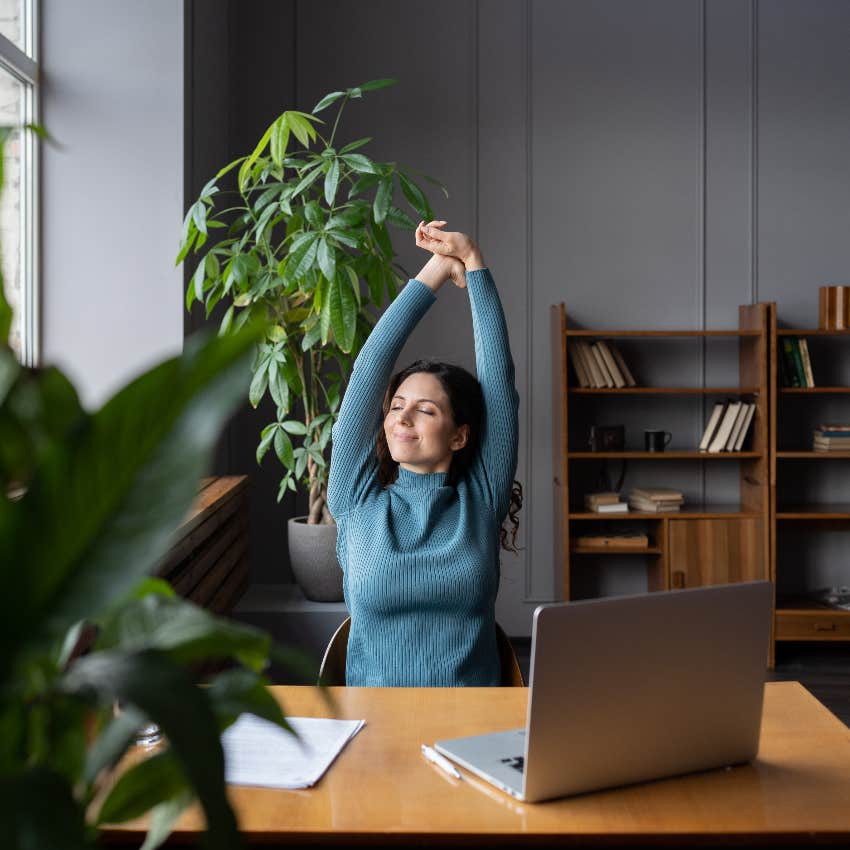 relaxed woman taking intentional break at work 