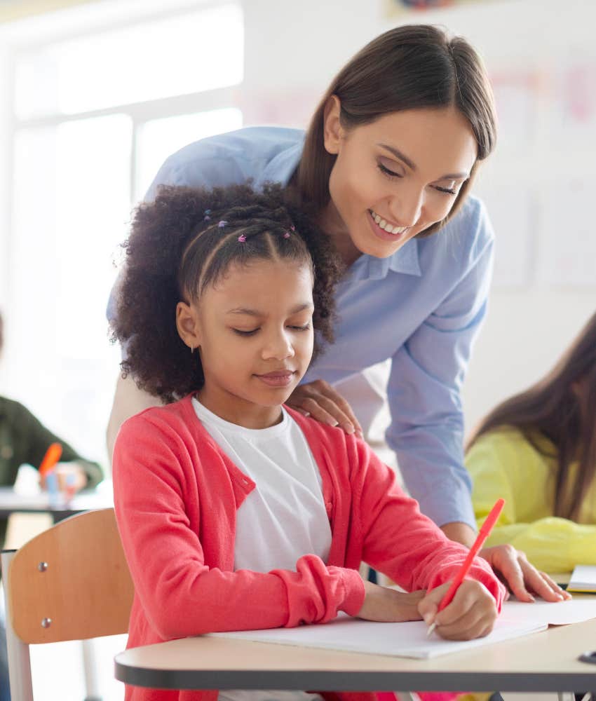 teacher who has support from admin helping young student