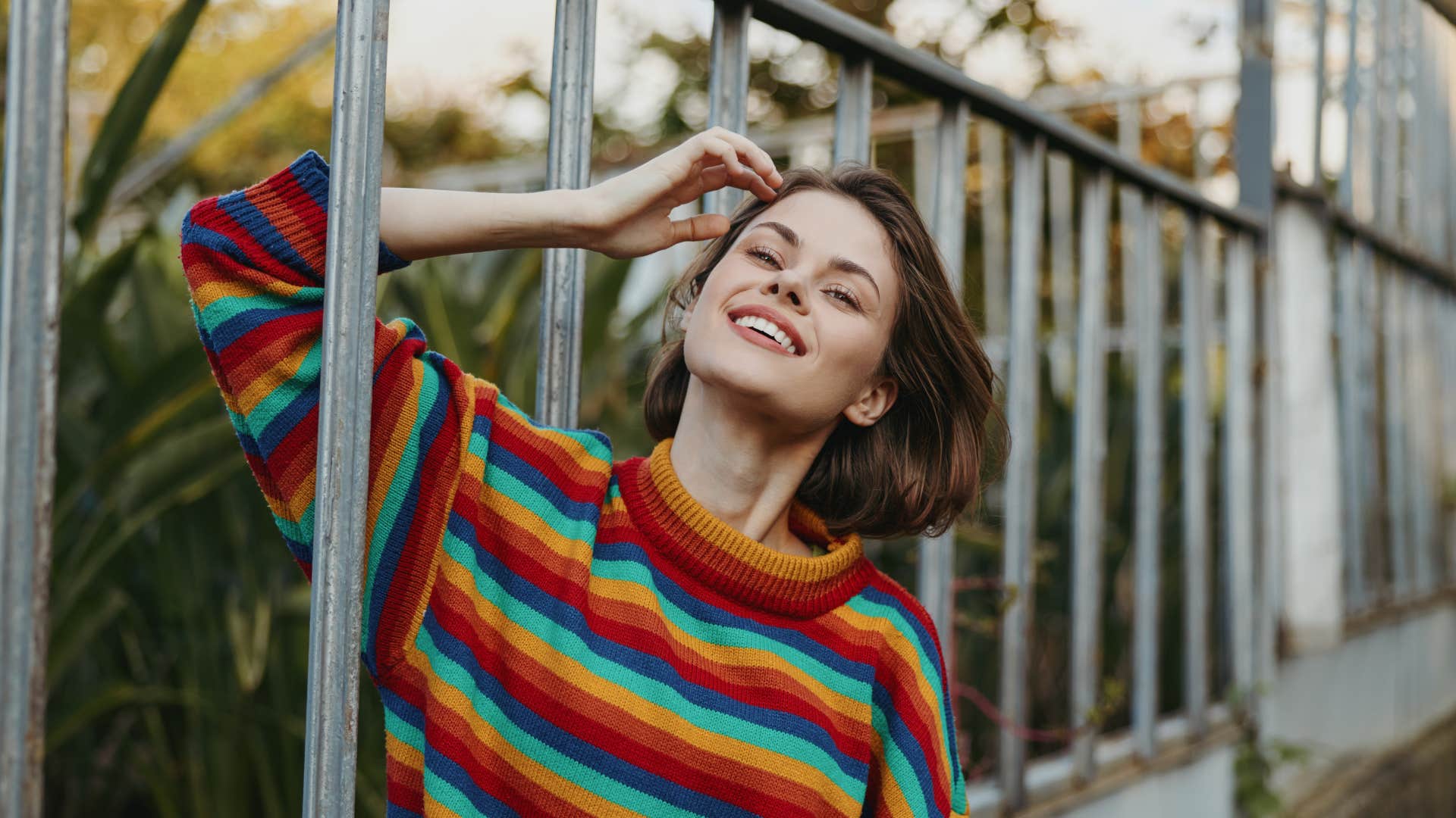 Flirty woman plays with hair showing way to attract men