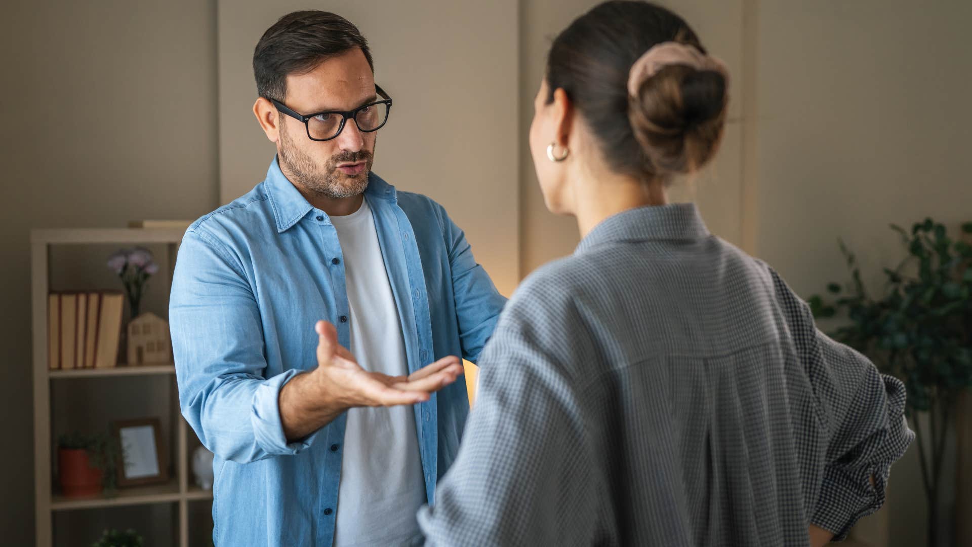 man talking to wife understanding that the people you love can also hurt you