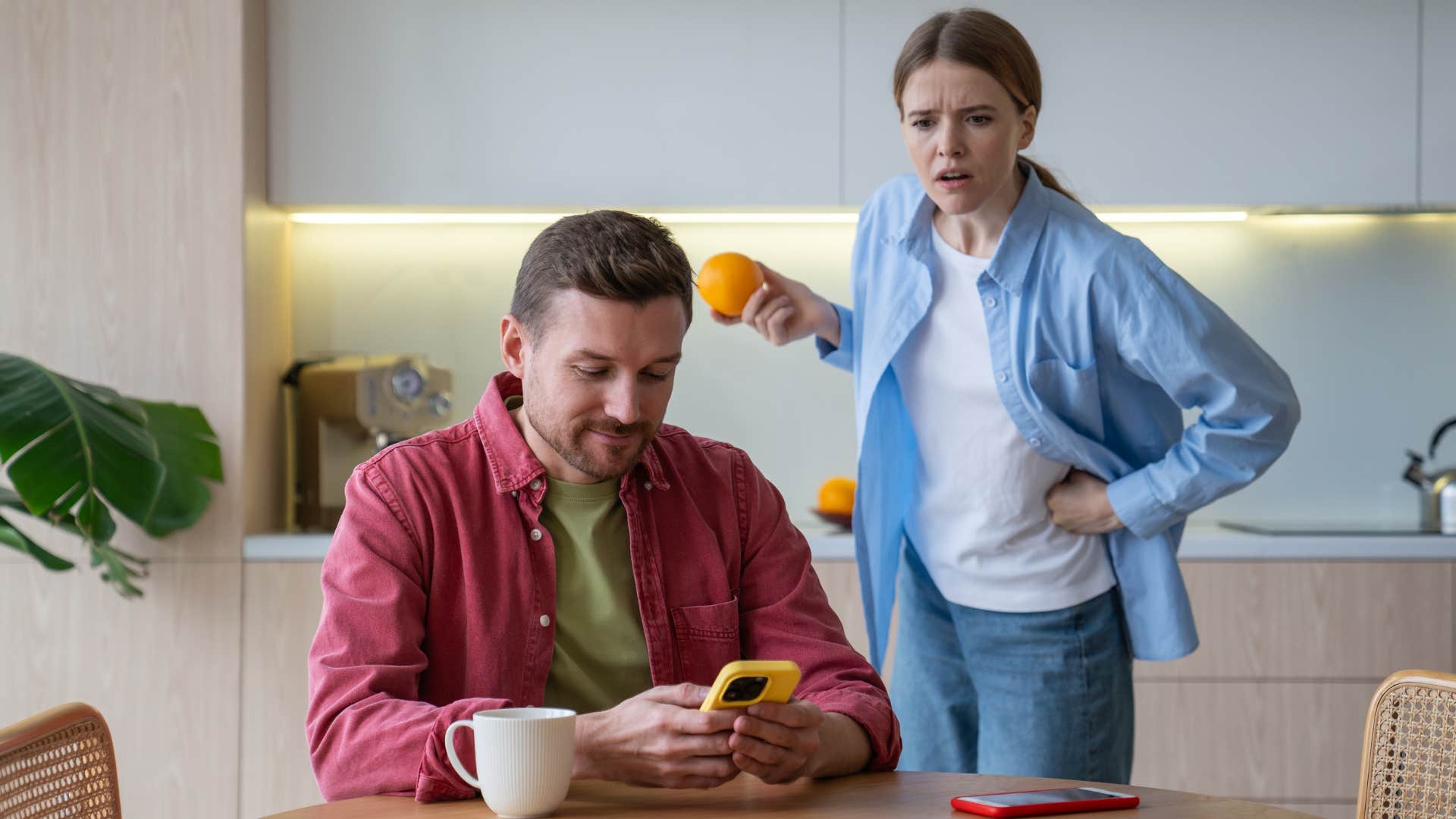 man who doesn't notice his wife's disengagement focused on his phone