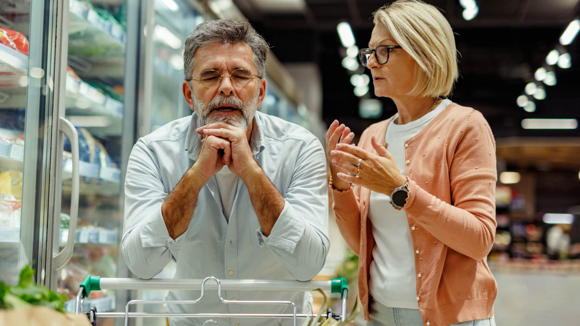 couple arguing at the grocery store with man equating providership to presence