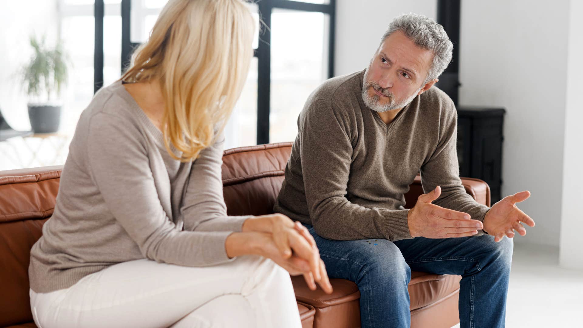 woman talking with man who refuses to change