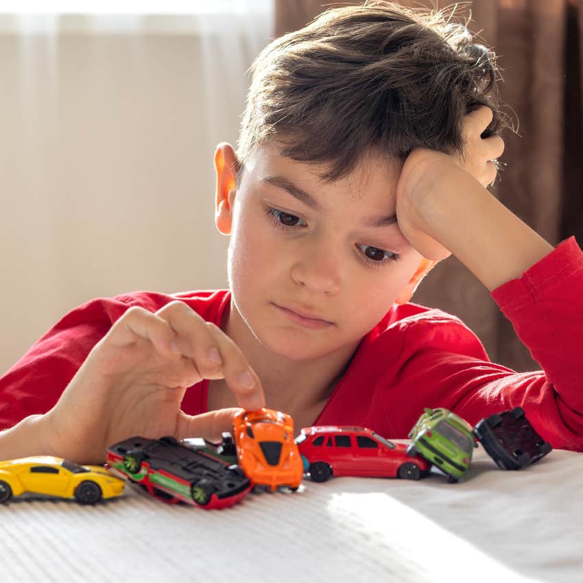 Little boy facing boredom without screens at home like kids in the 1970s used to