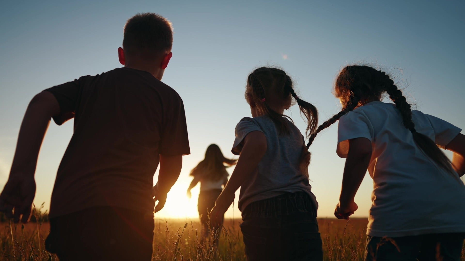 kids playing outside until the streetlights come on that feel impossible now