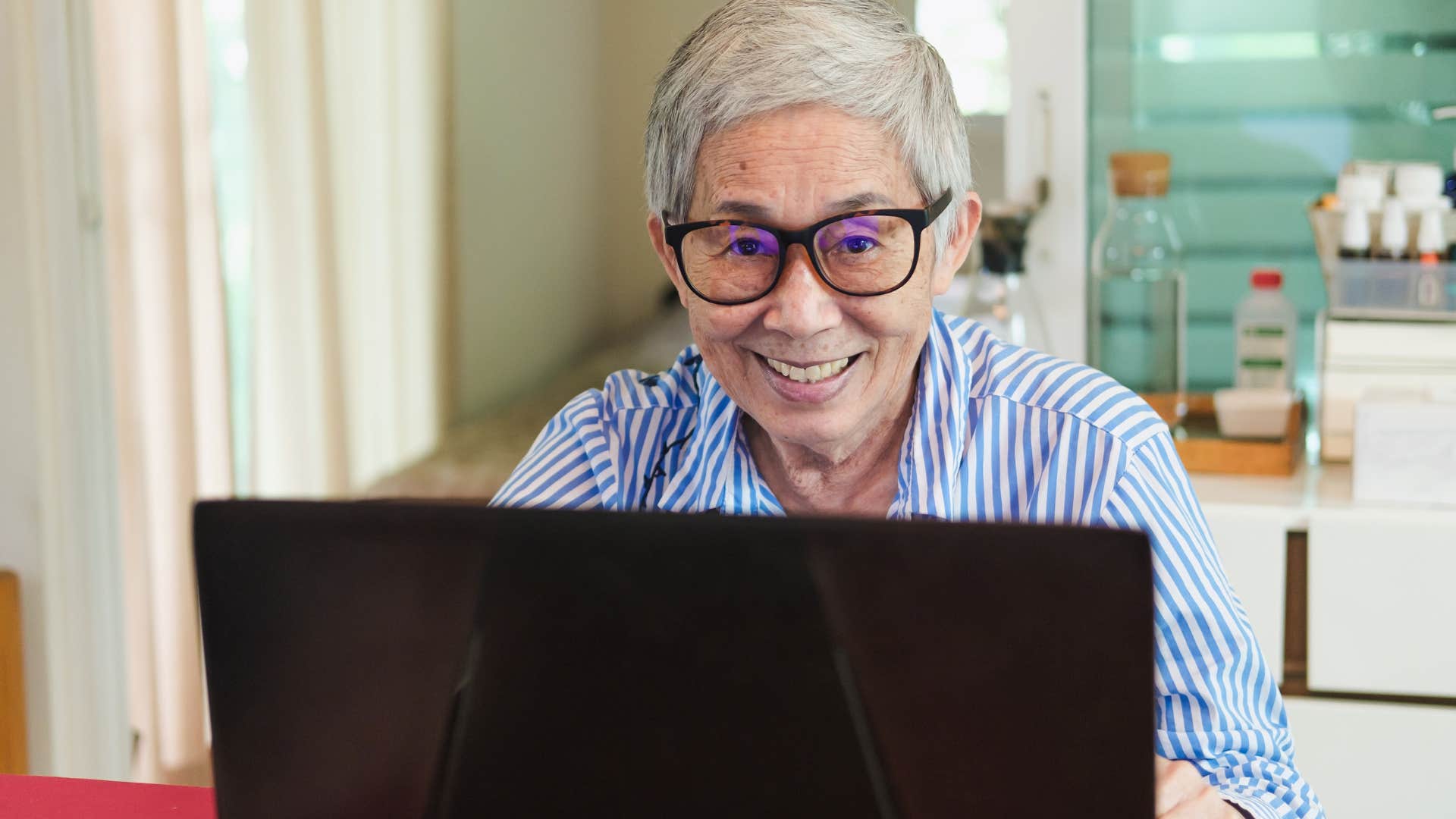 woman crafting emails like formal letters on her laptop