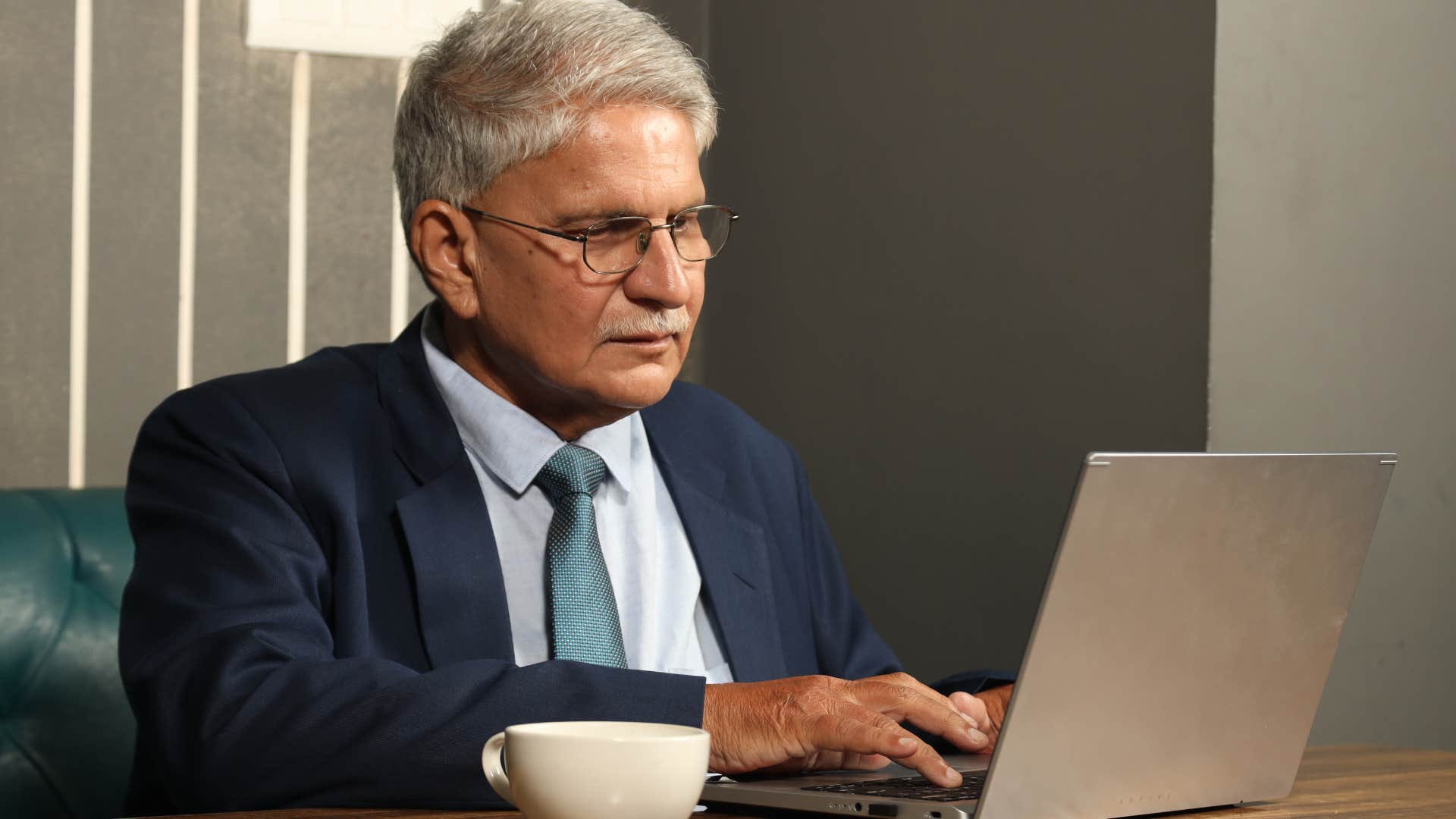 professional man who overuses ellipses in his emails