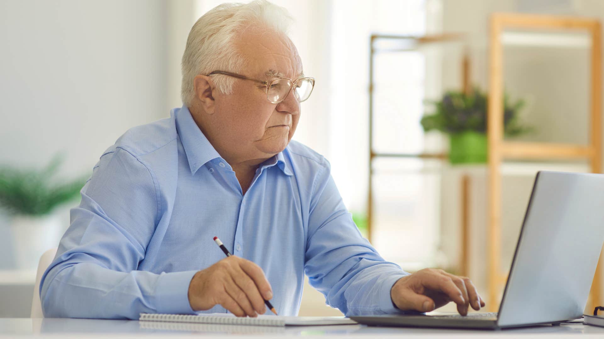 older man who doesn't know how to use a computer sending email attachments without double-checking