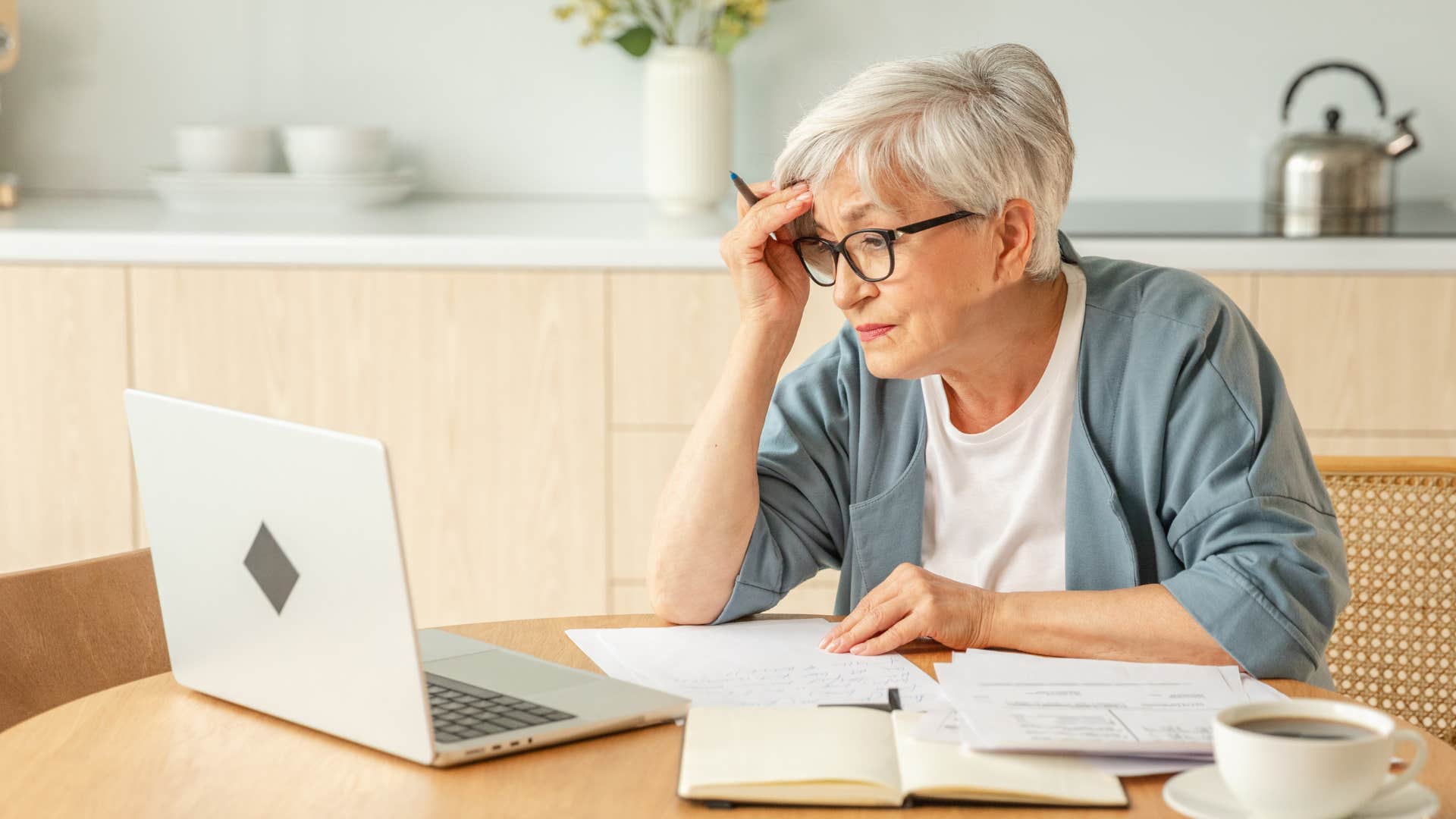 woman working on laptop writing emails saying please advise