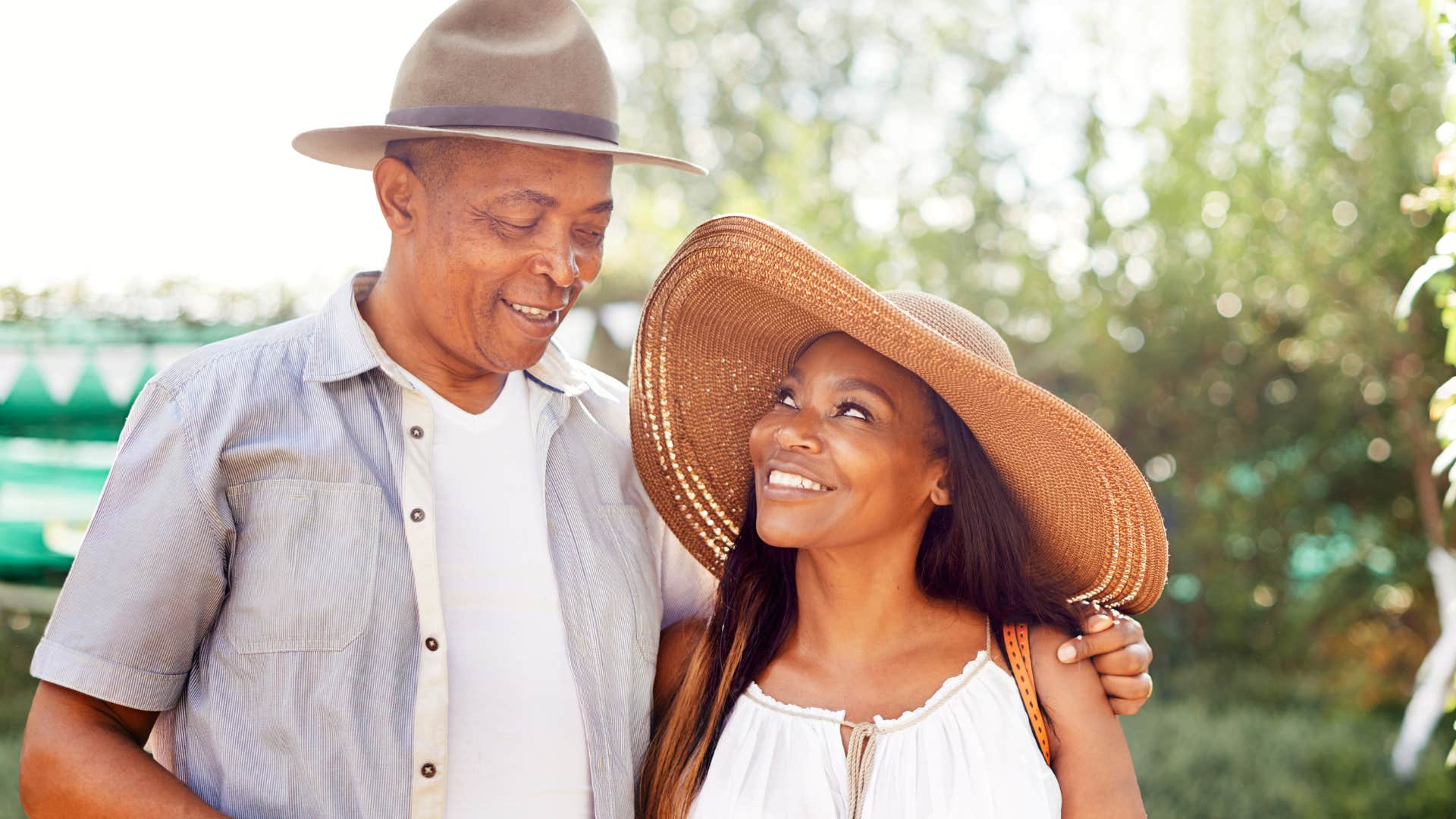 Woman smiling at an older man who's less emotionally reactive.